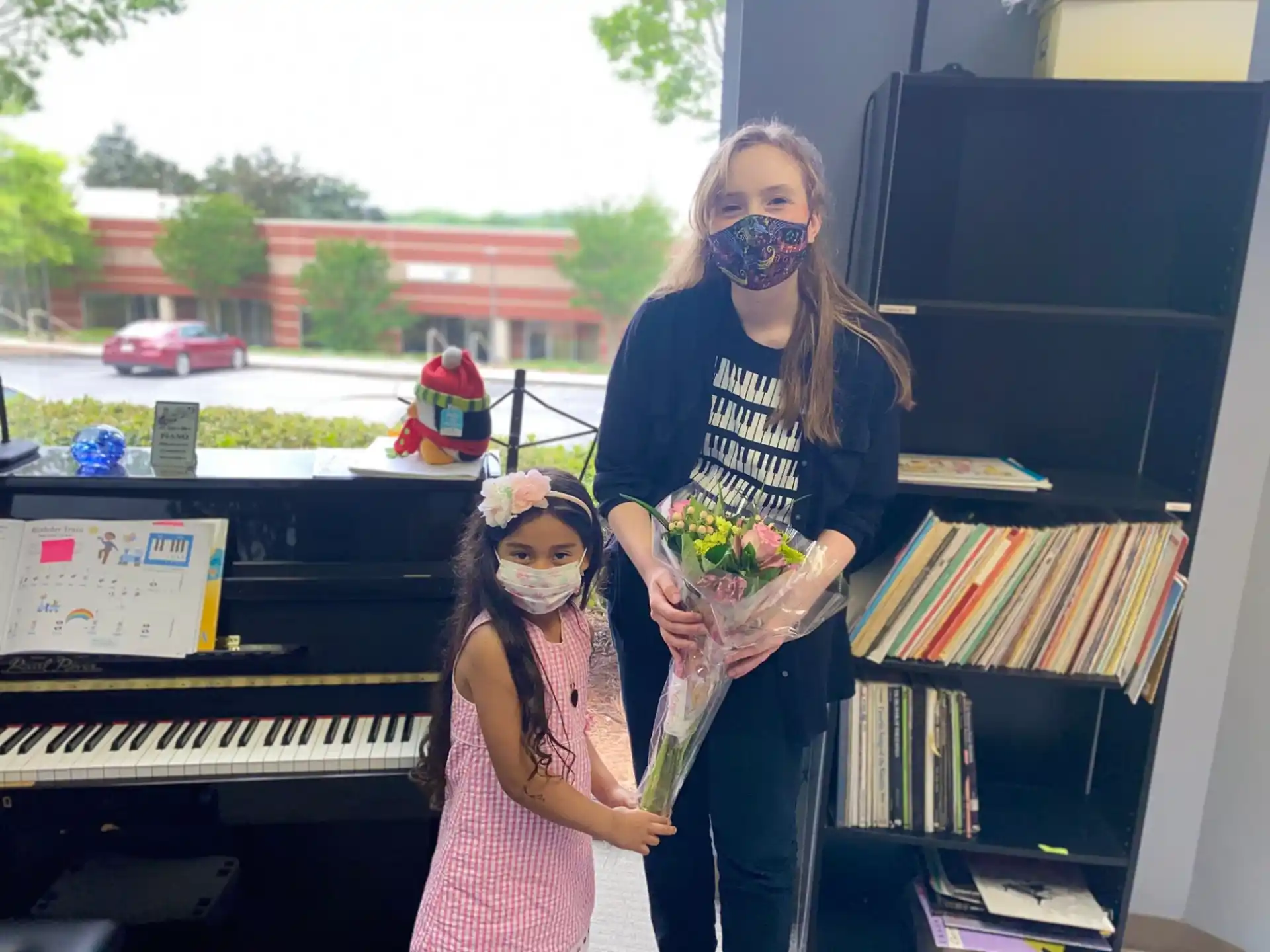 a woman and a girl with flowers