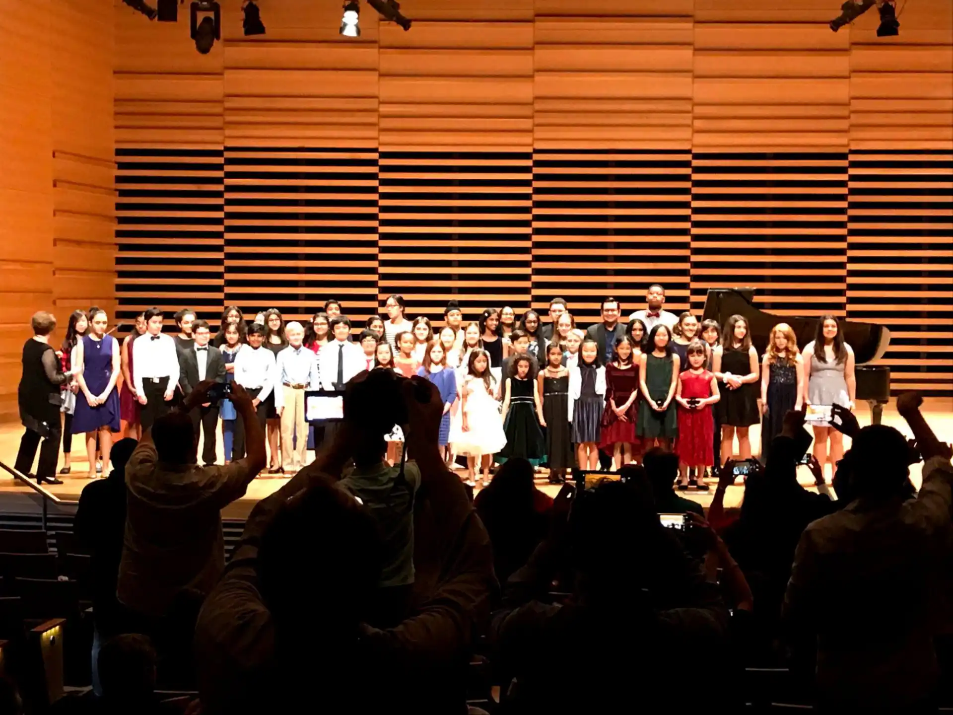 a group of people performing on stage