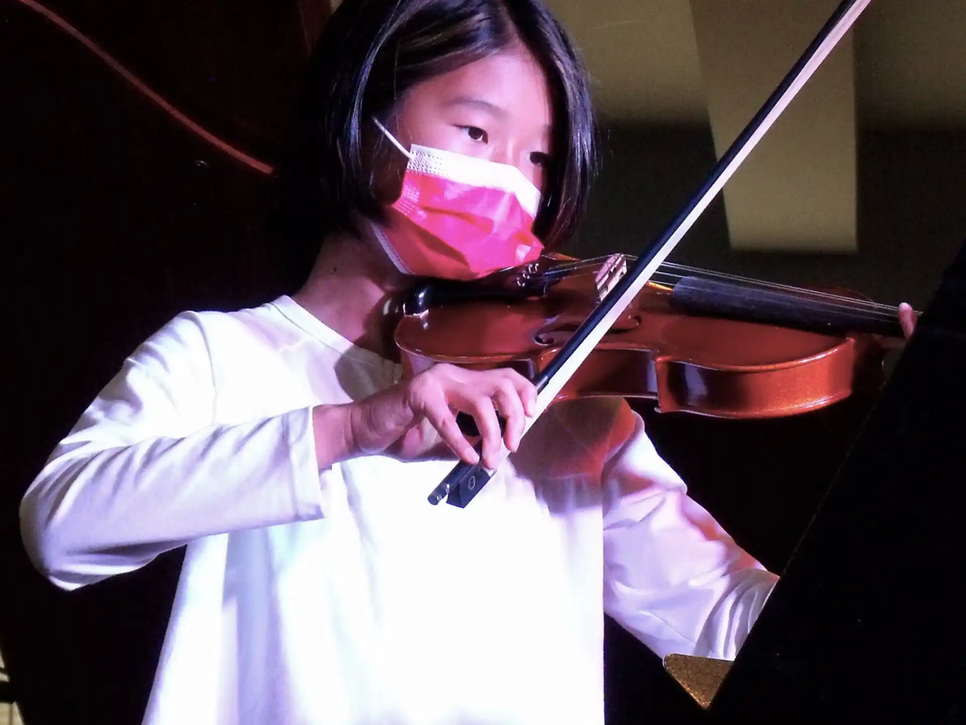 a person playing a violin