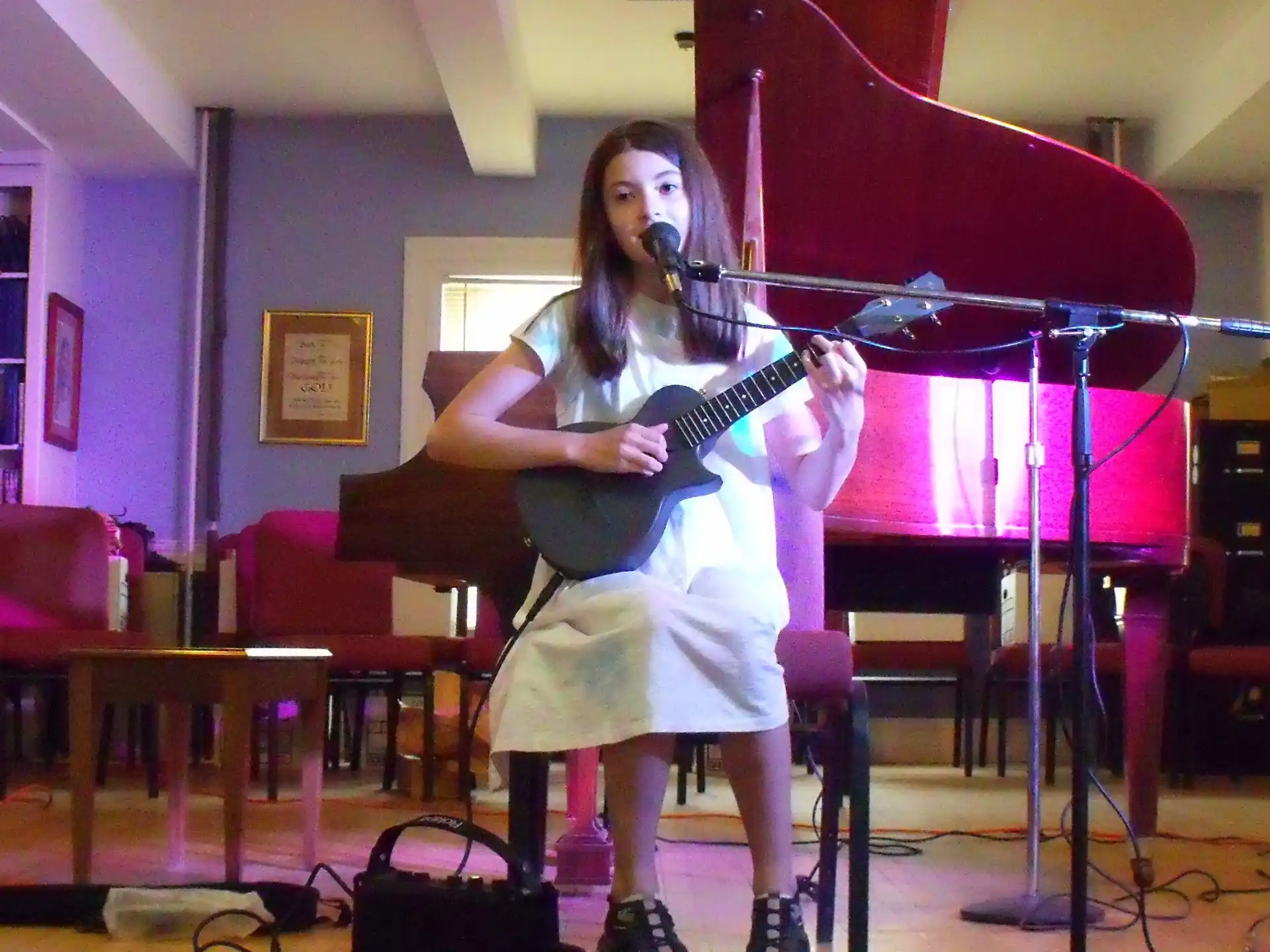 a woman playing a guitar