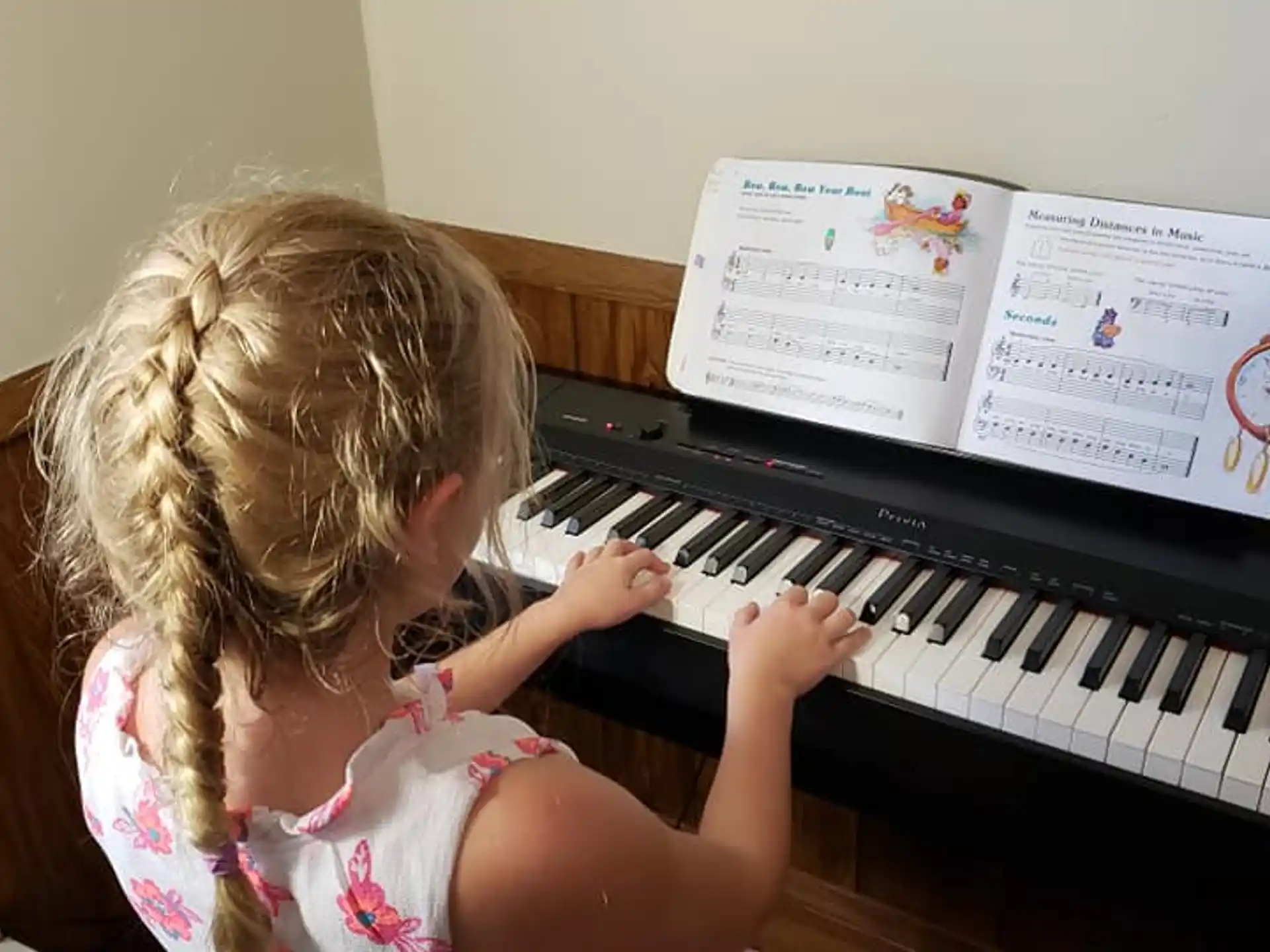 a girl playing a piano