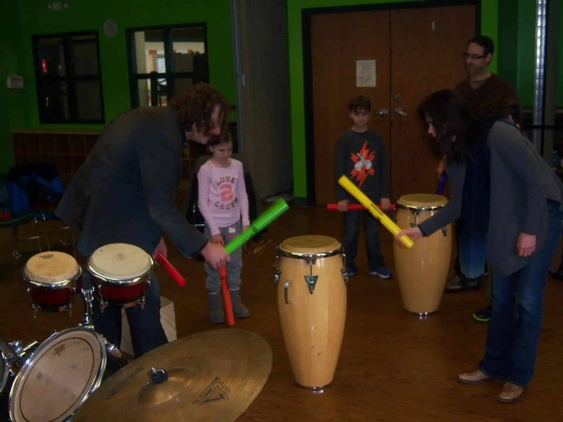 a group of people playing drums