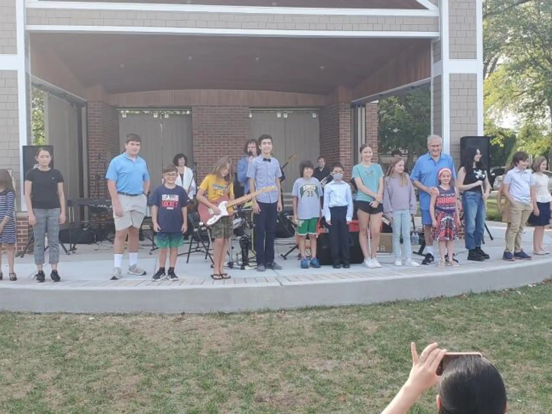 a group of people standing on a stage