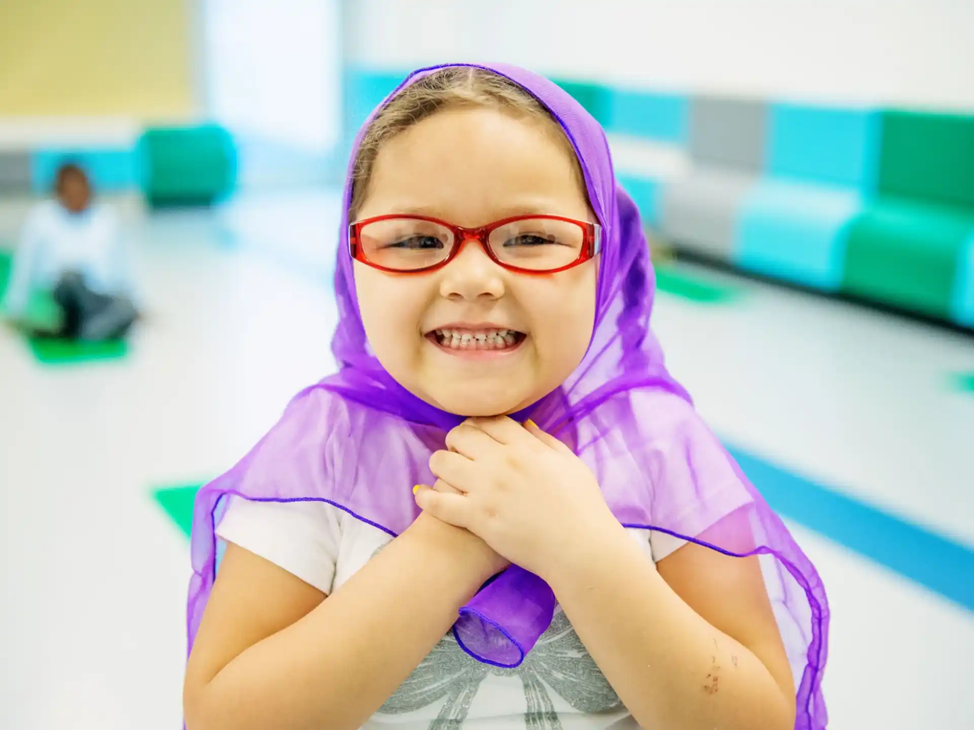 a girl wearing a purple hoodie