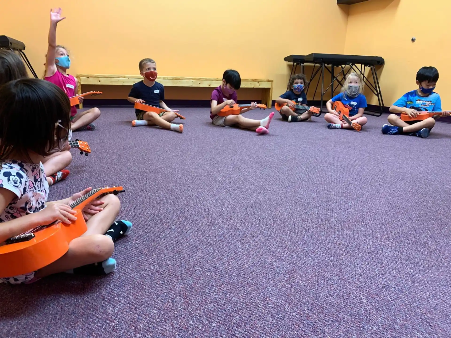 a group of children sitting on the floor
