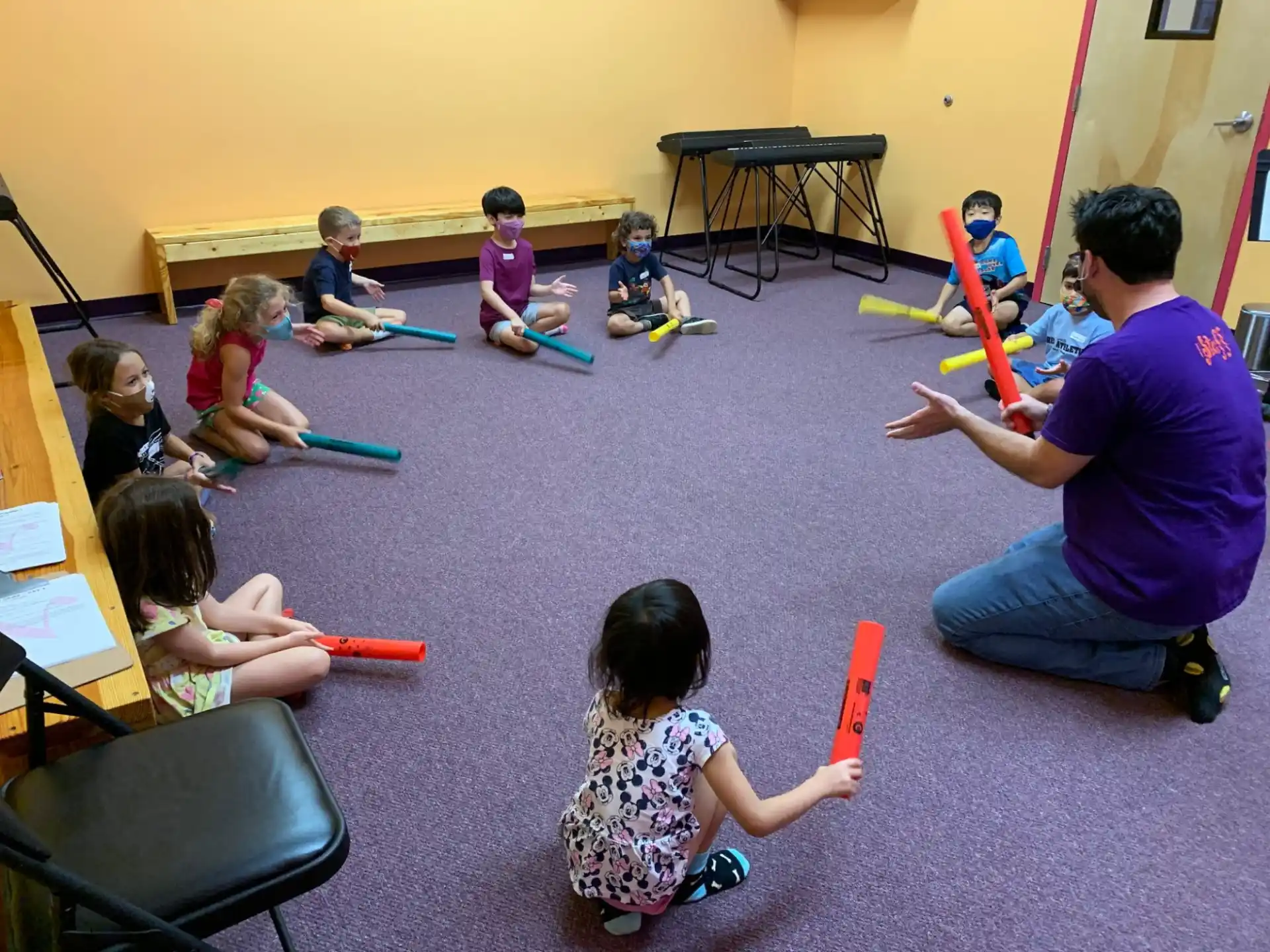 a person teaching children in a classroom