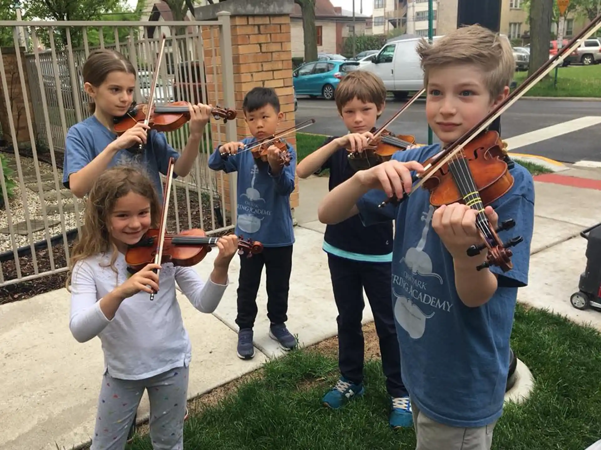 a group of kids holding musical instruments