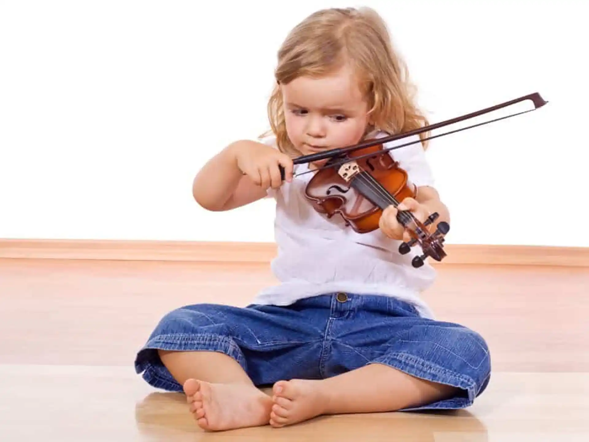a young girl playing a violin