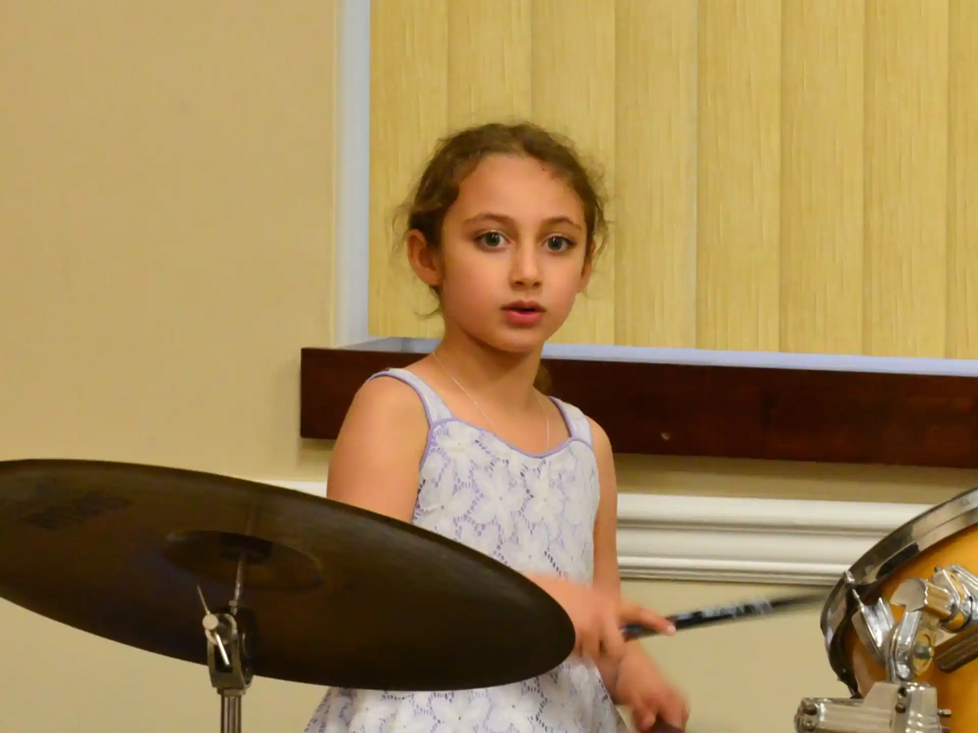 a girl playing the drums