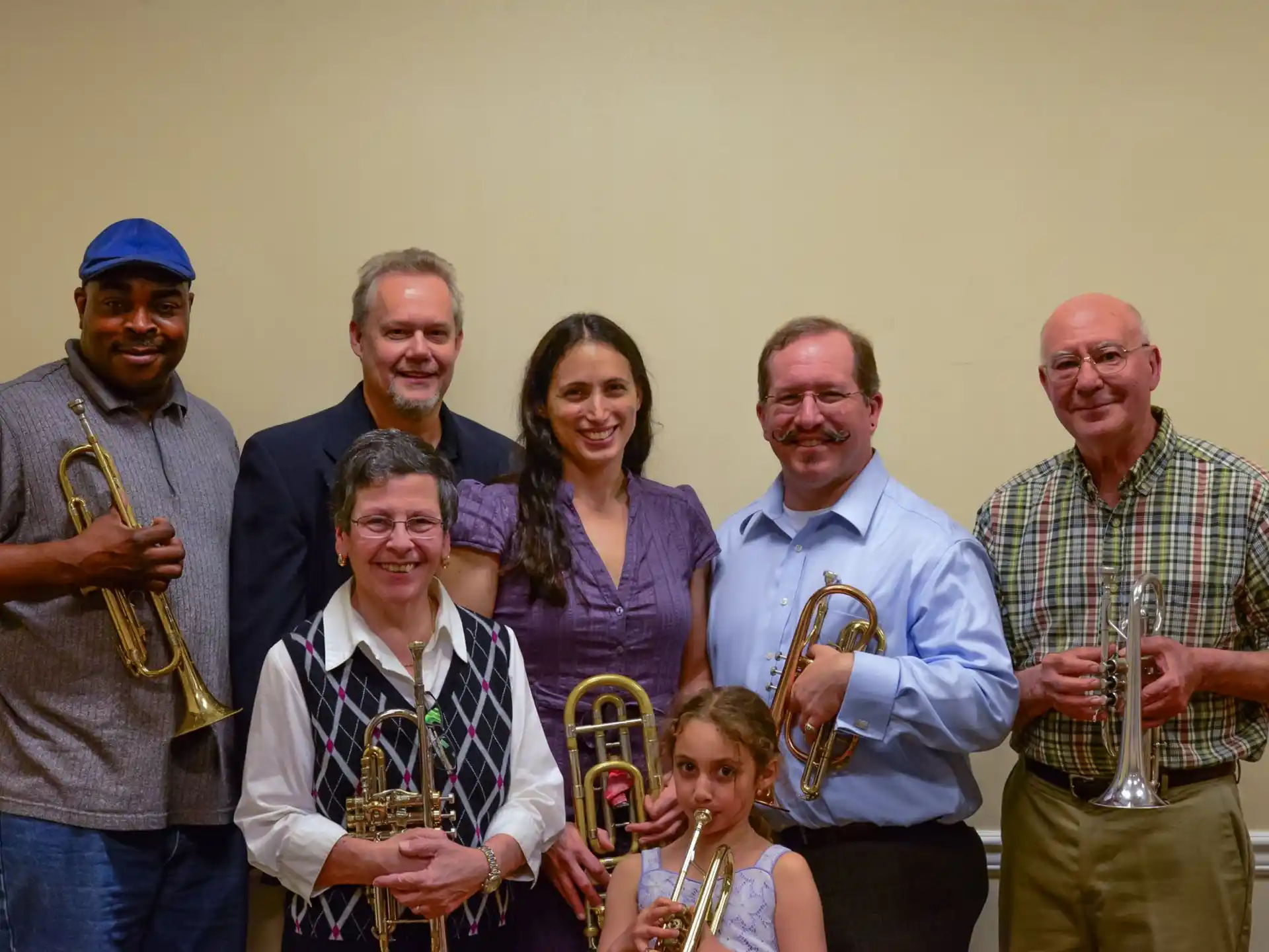 a group of people holding trophies