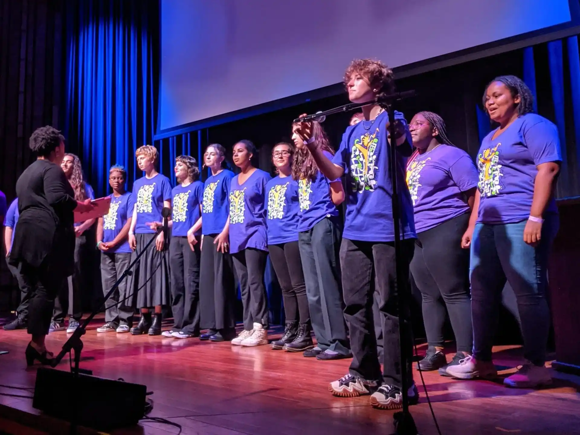 a group of people standing on a stage