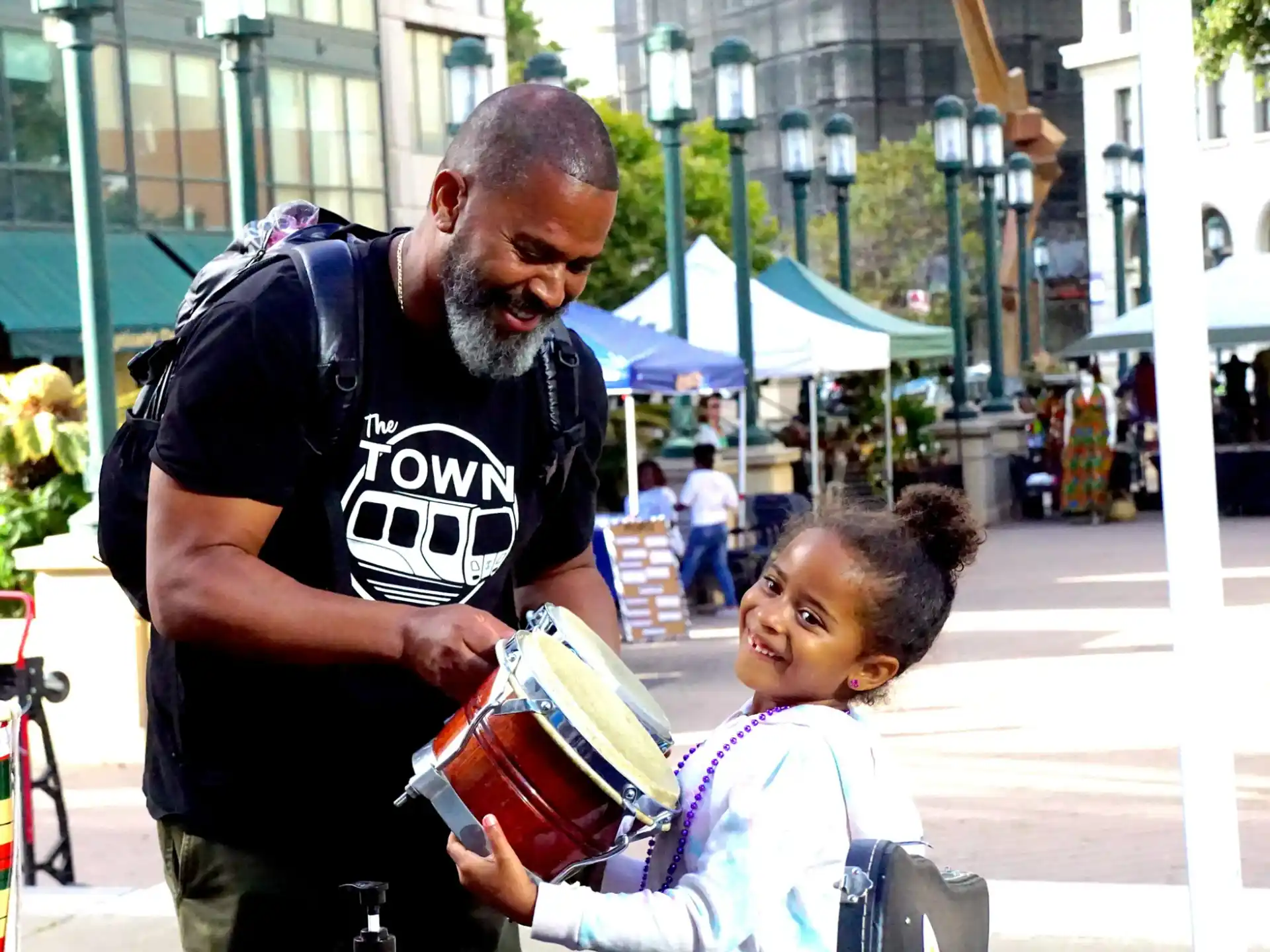 a man and a child holding a basket