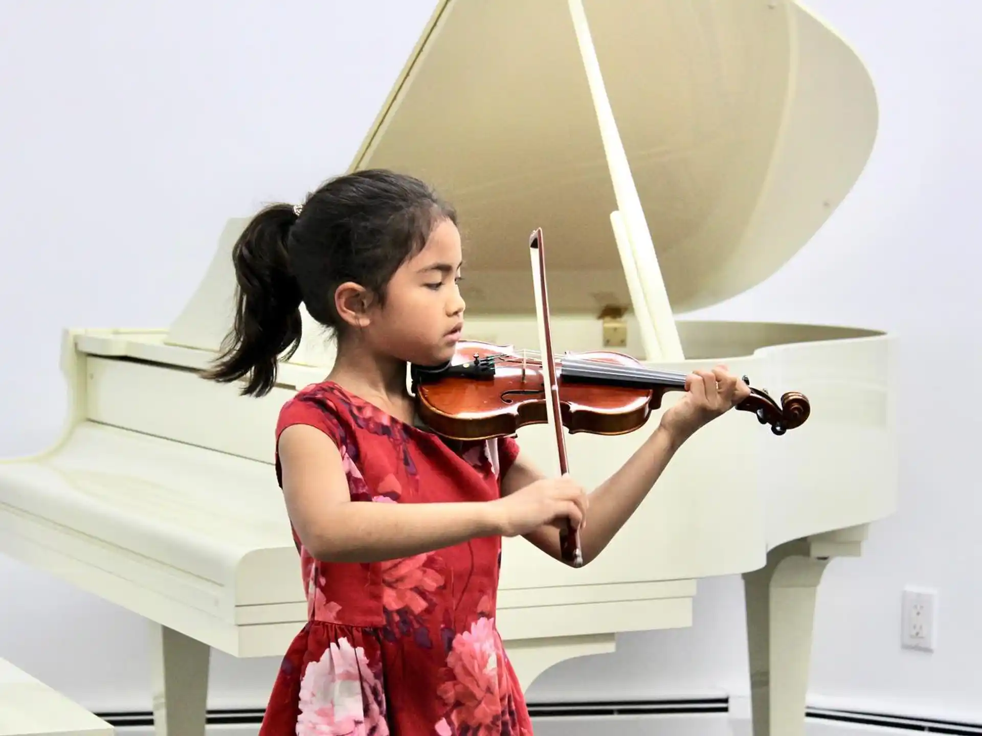 a girl playing a violin