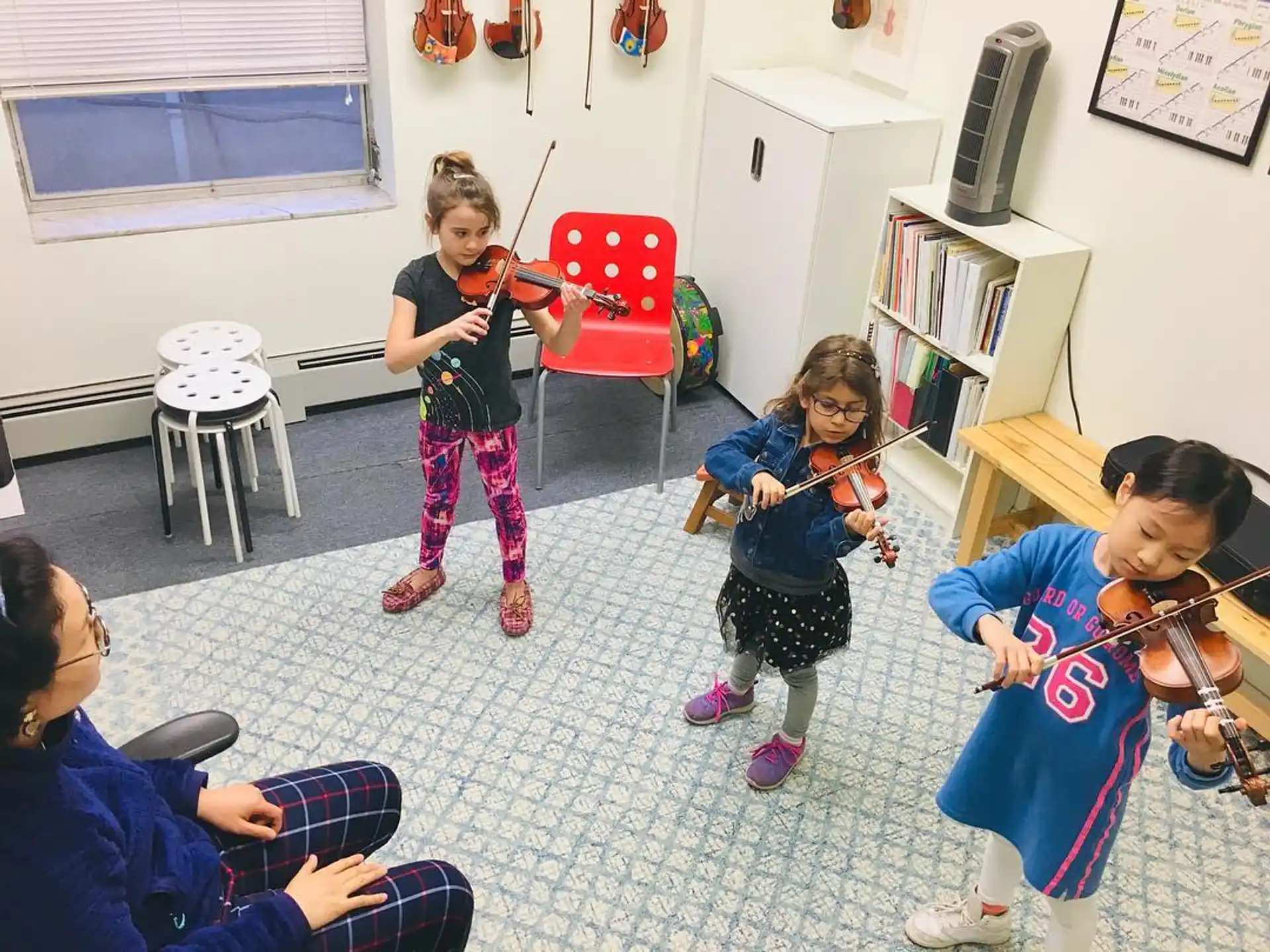 a group of children playing instruments