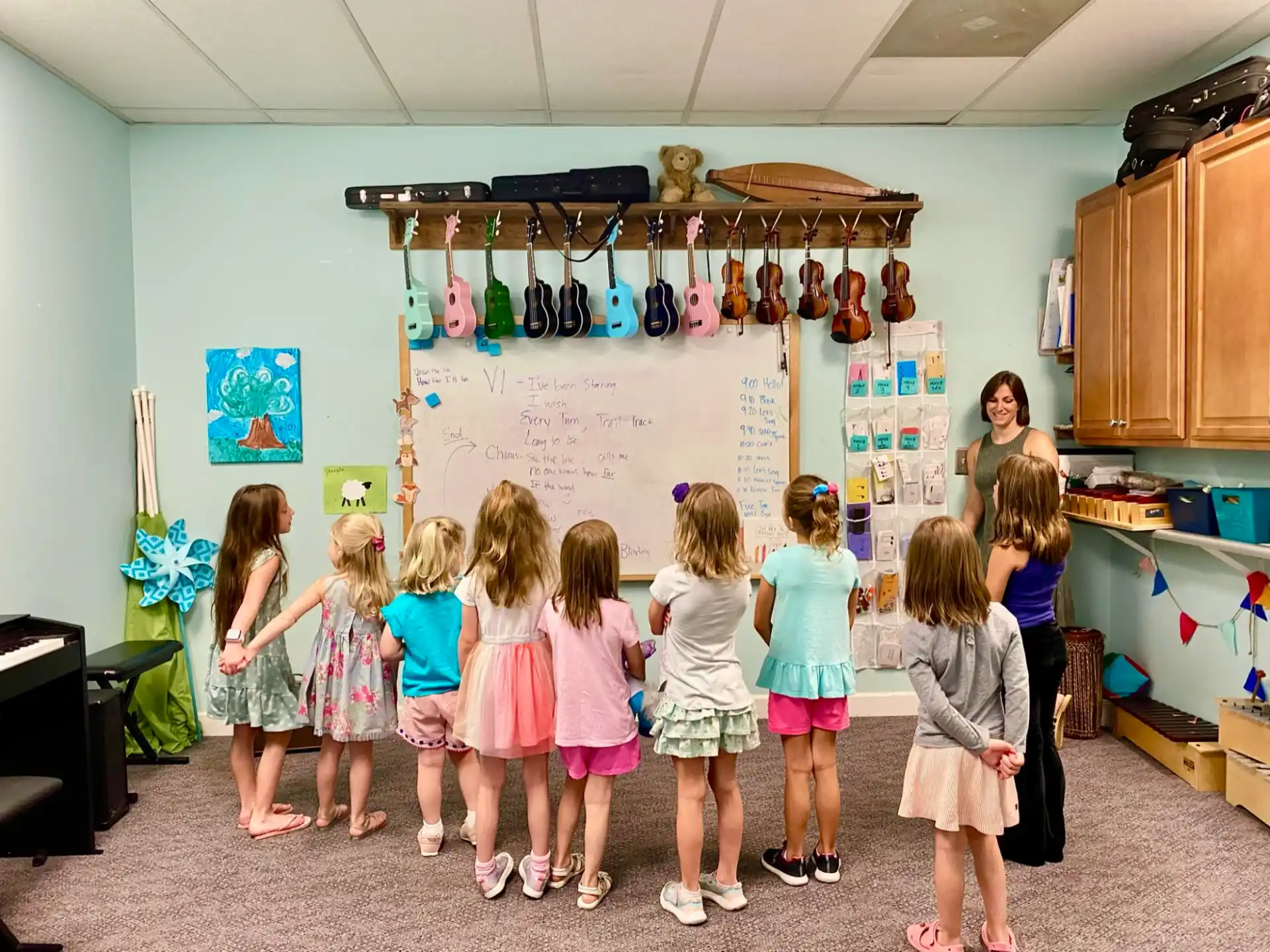 a group of children standing in a room