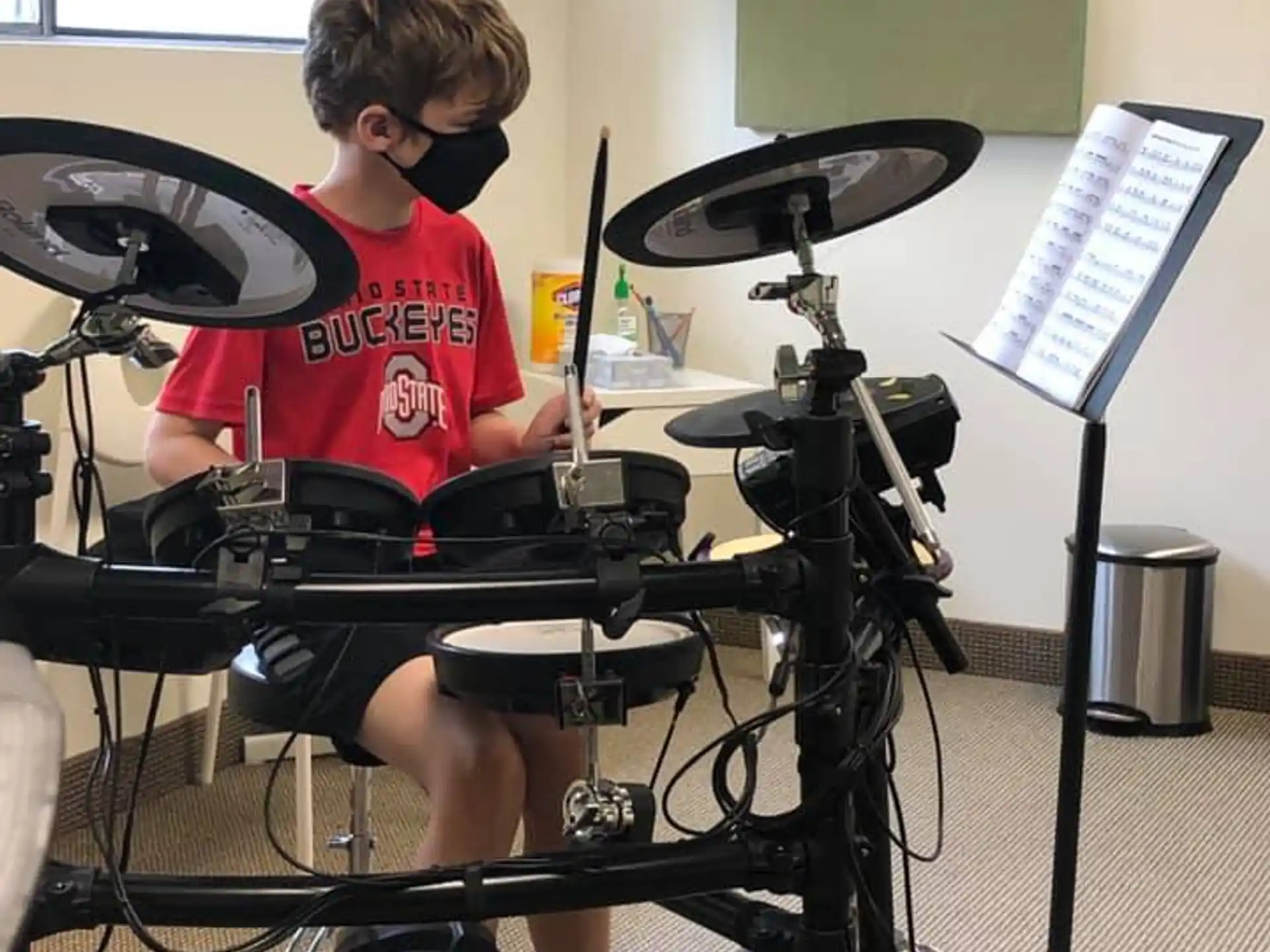 a boy playing the drums