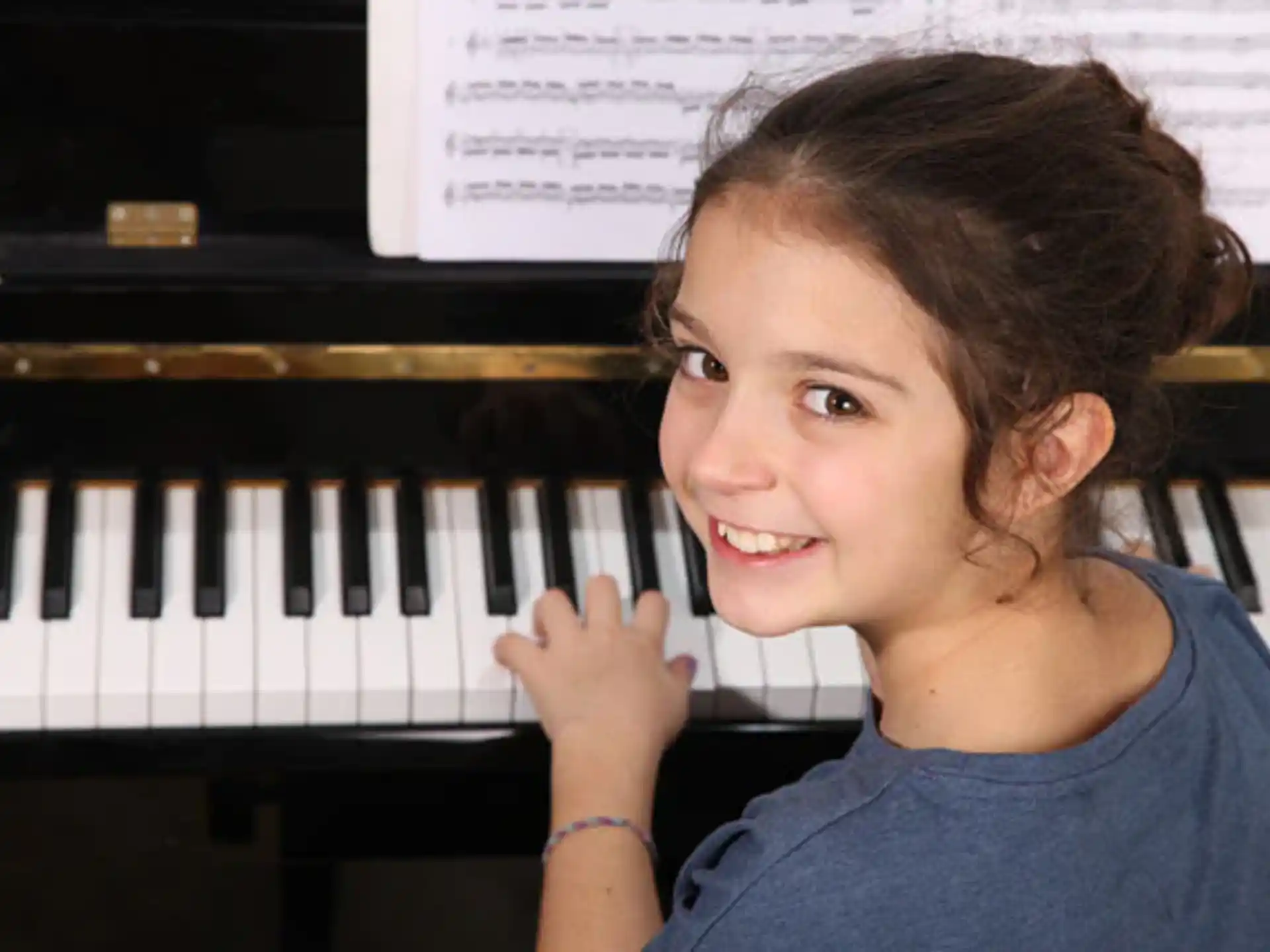 a young girl smiling