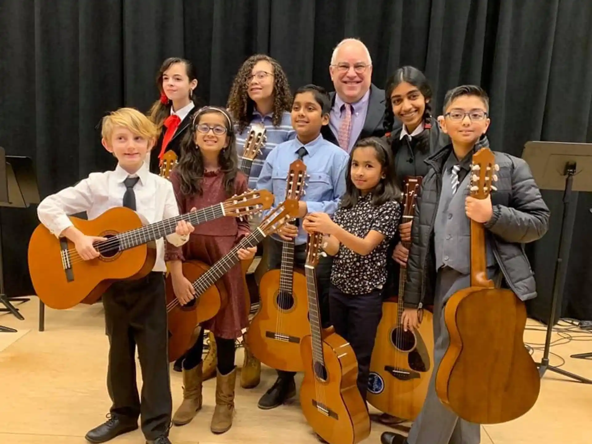a group of people holding guitars