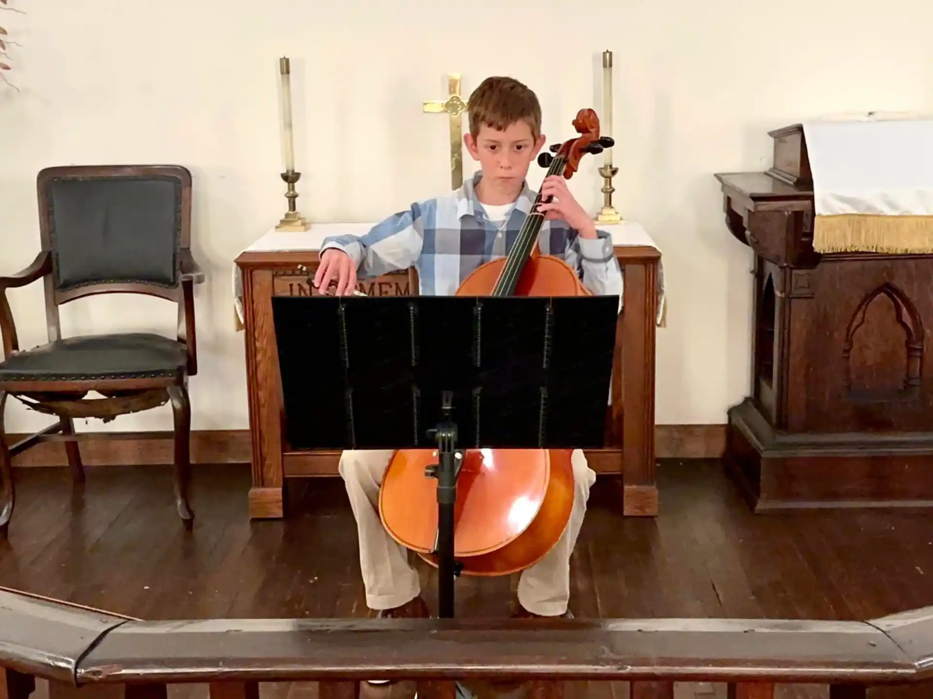 a boy playing a violin