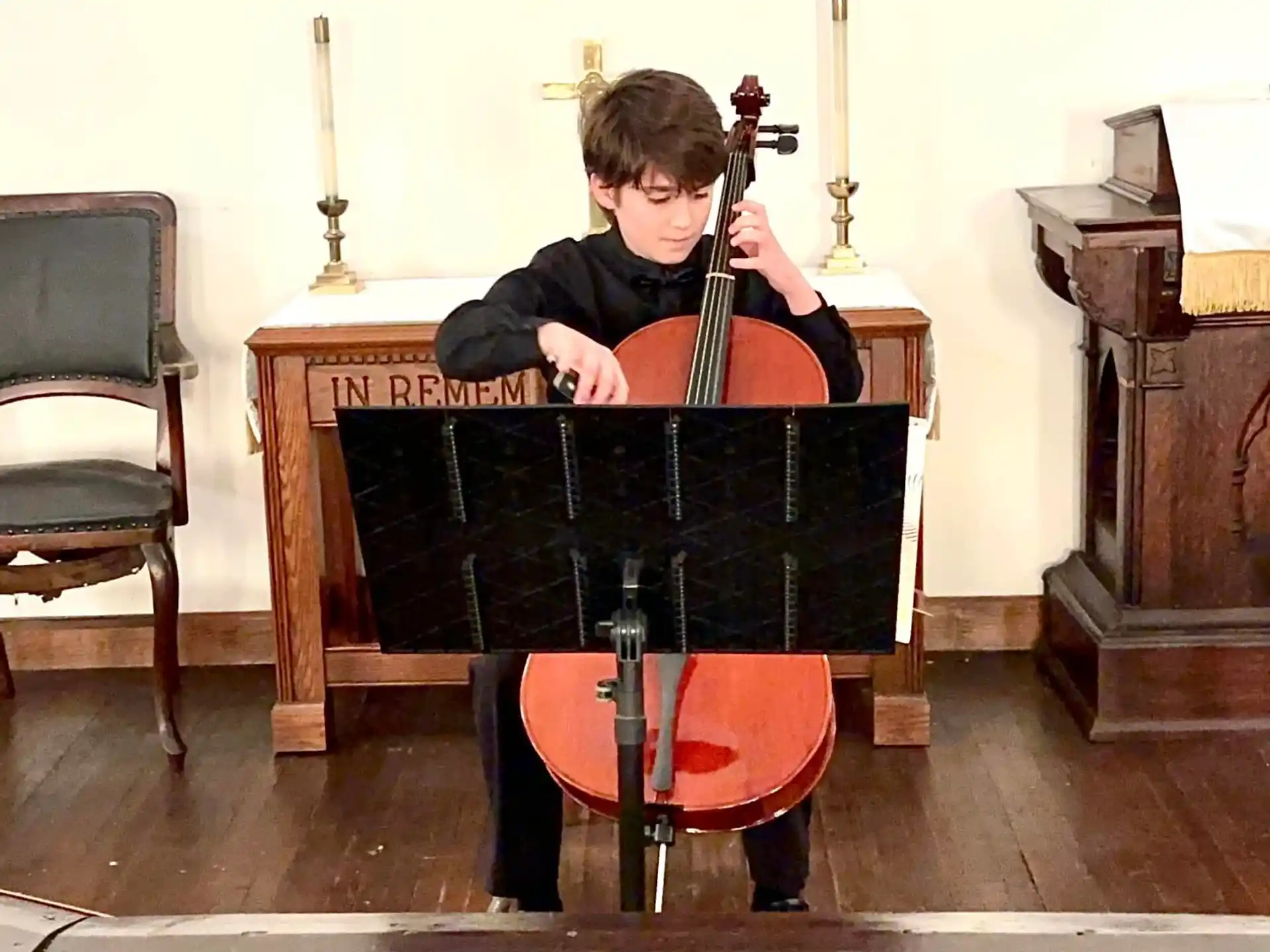 a boy playing a violin