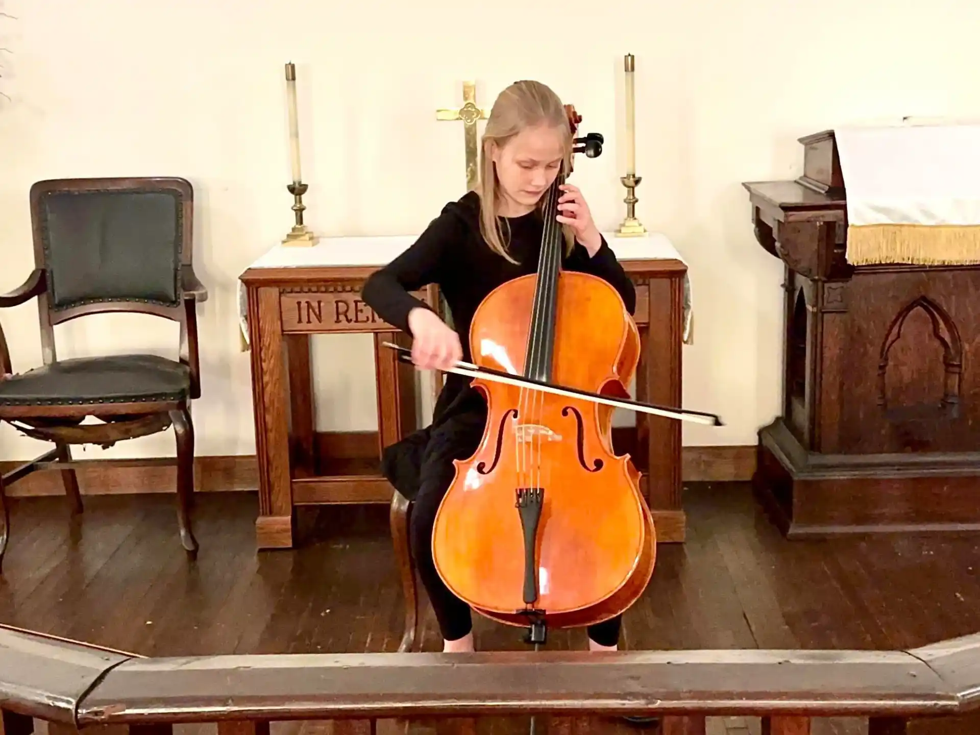 a person playing a cello