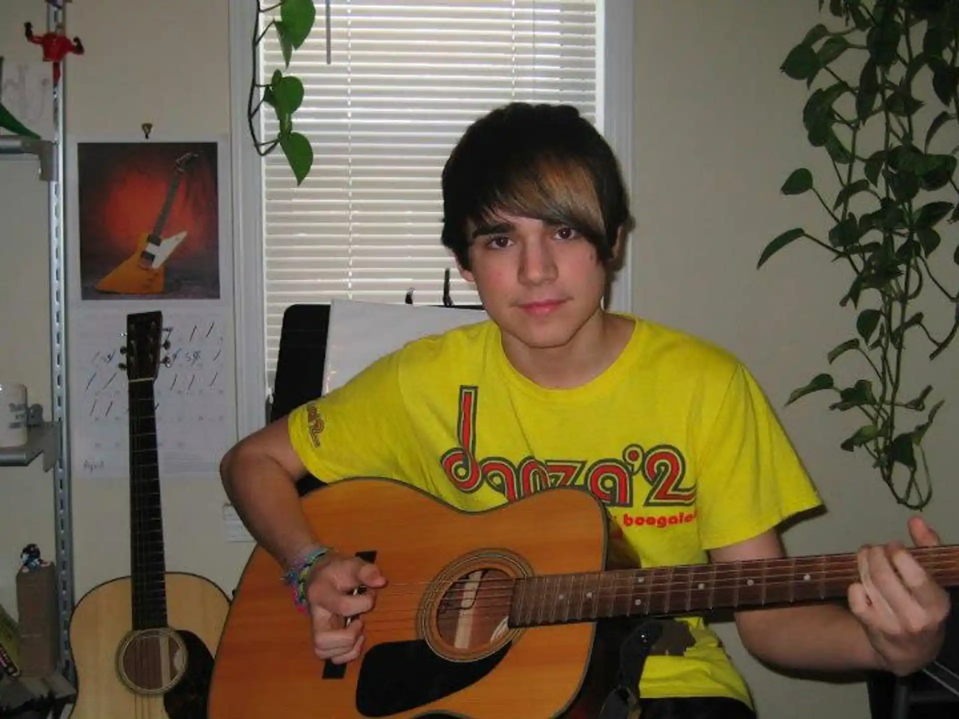 a man holding a guitar