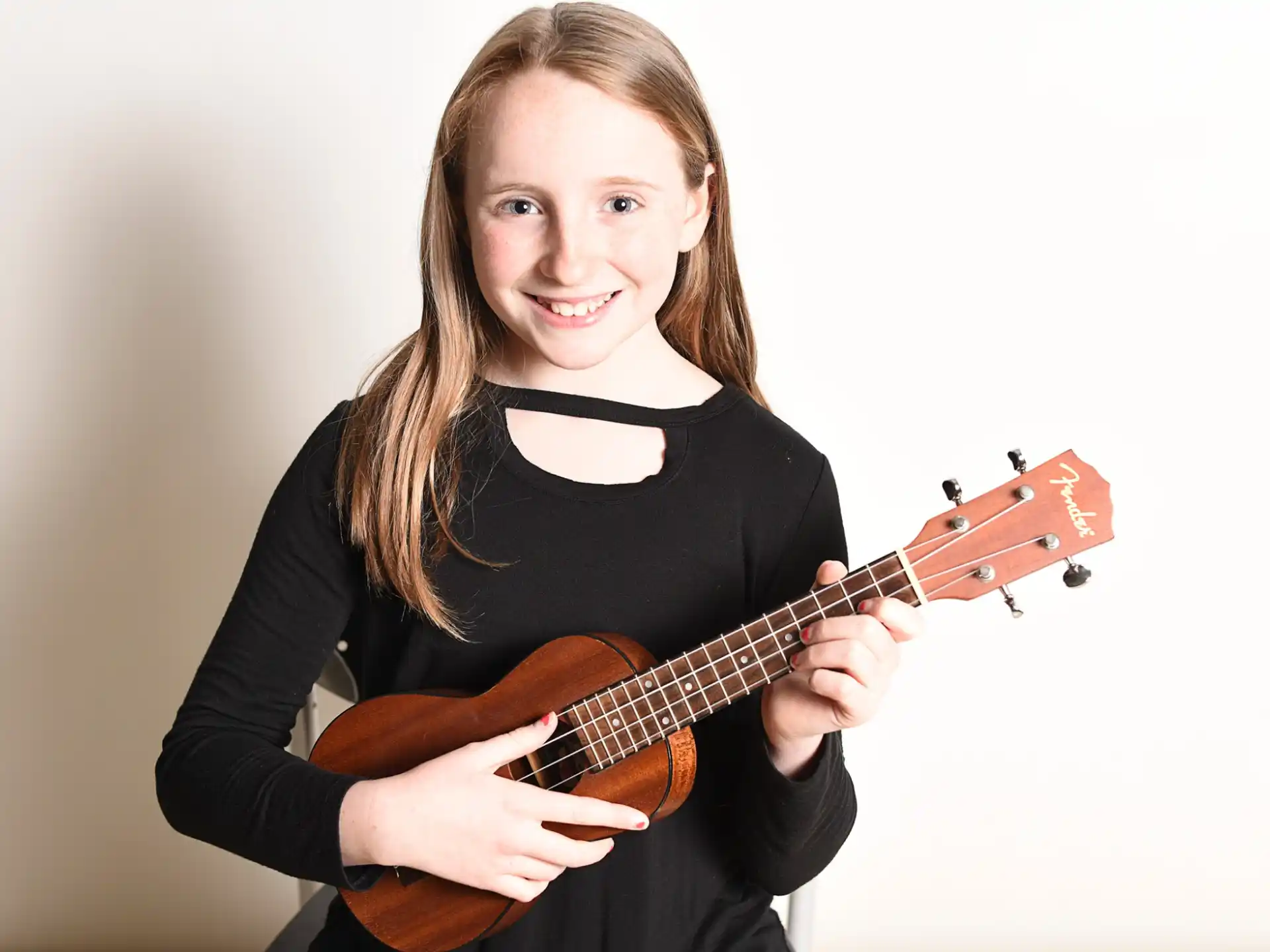 a woman holding a guitar