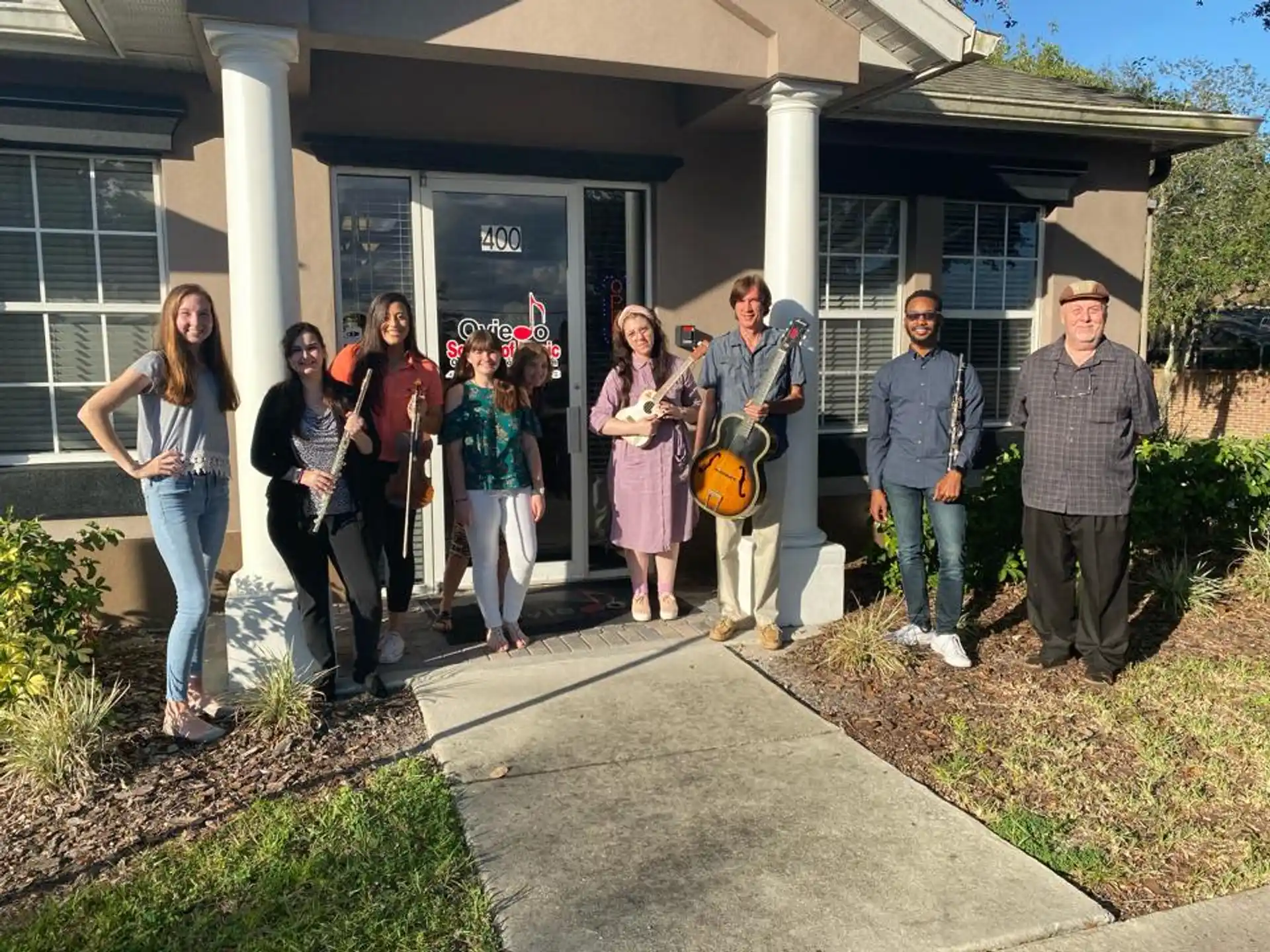 a group of people standing outside a building