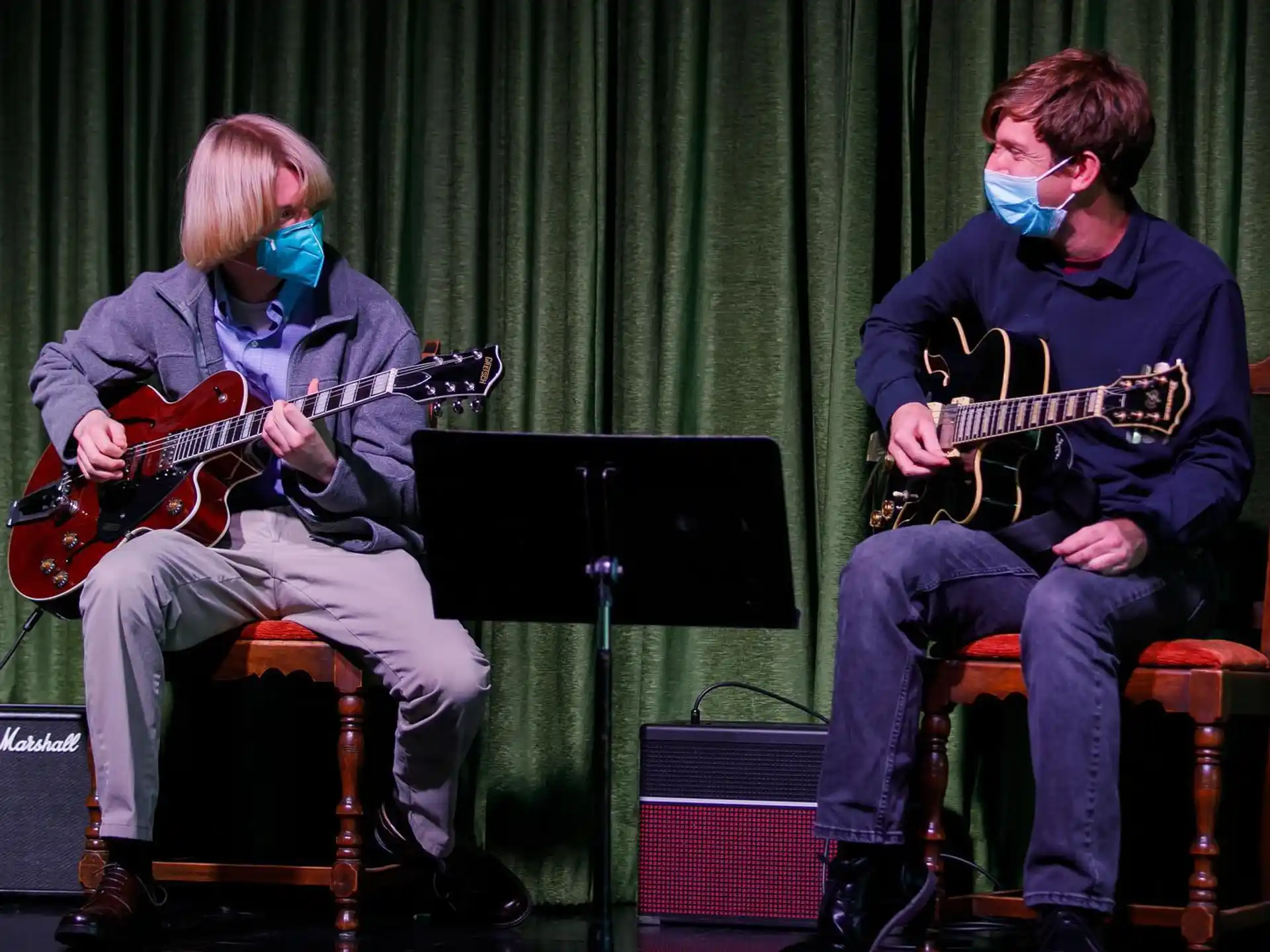 a group of men playing guitars