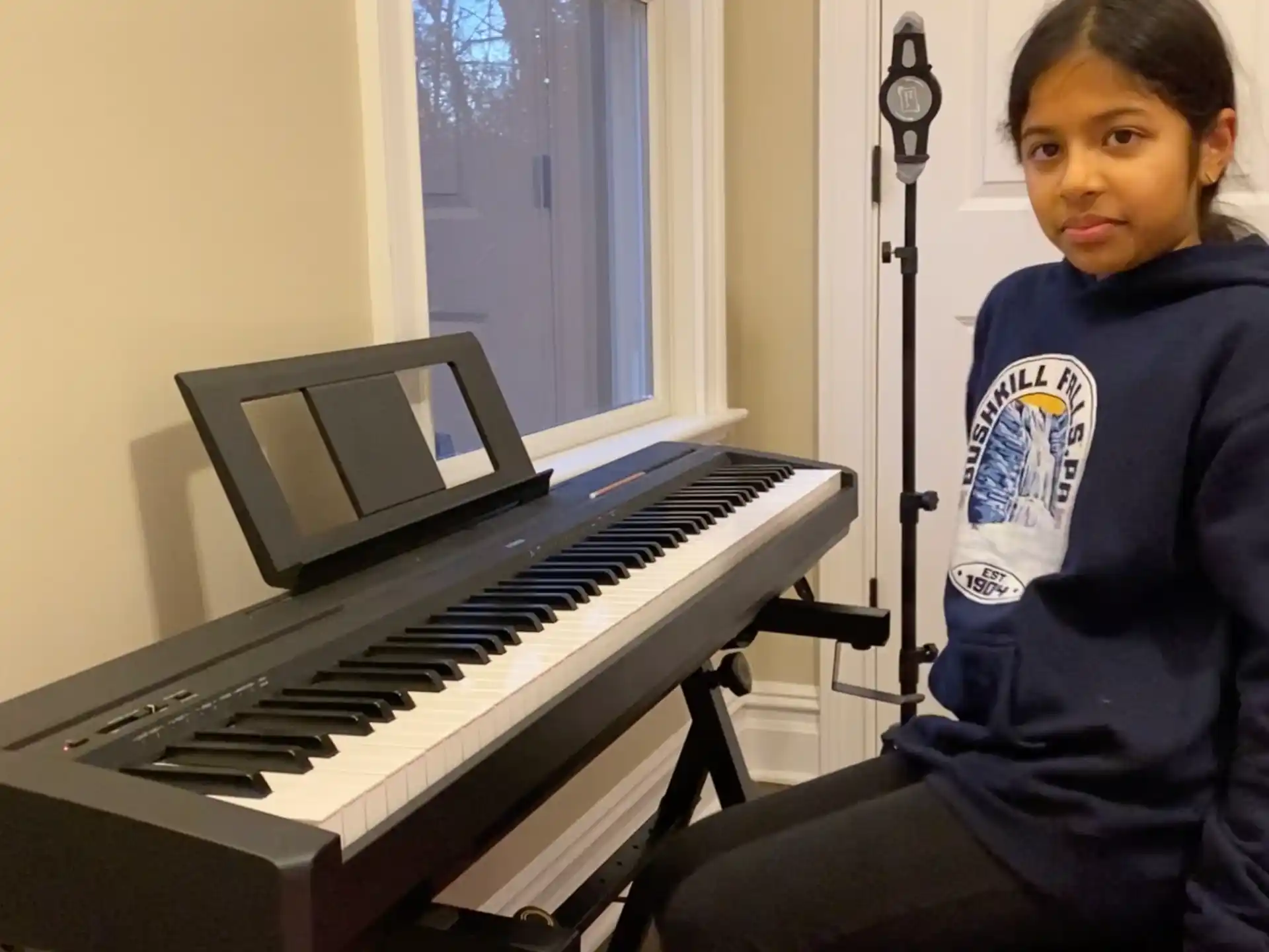 a person sitting at a piano