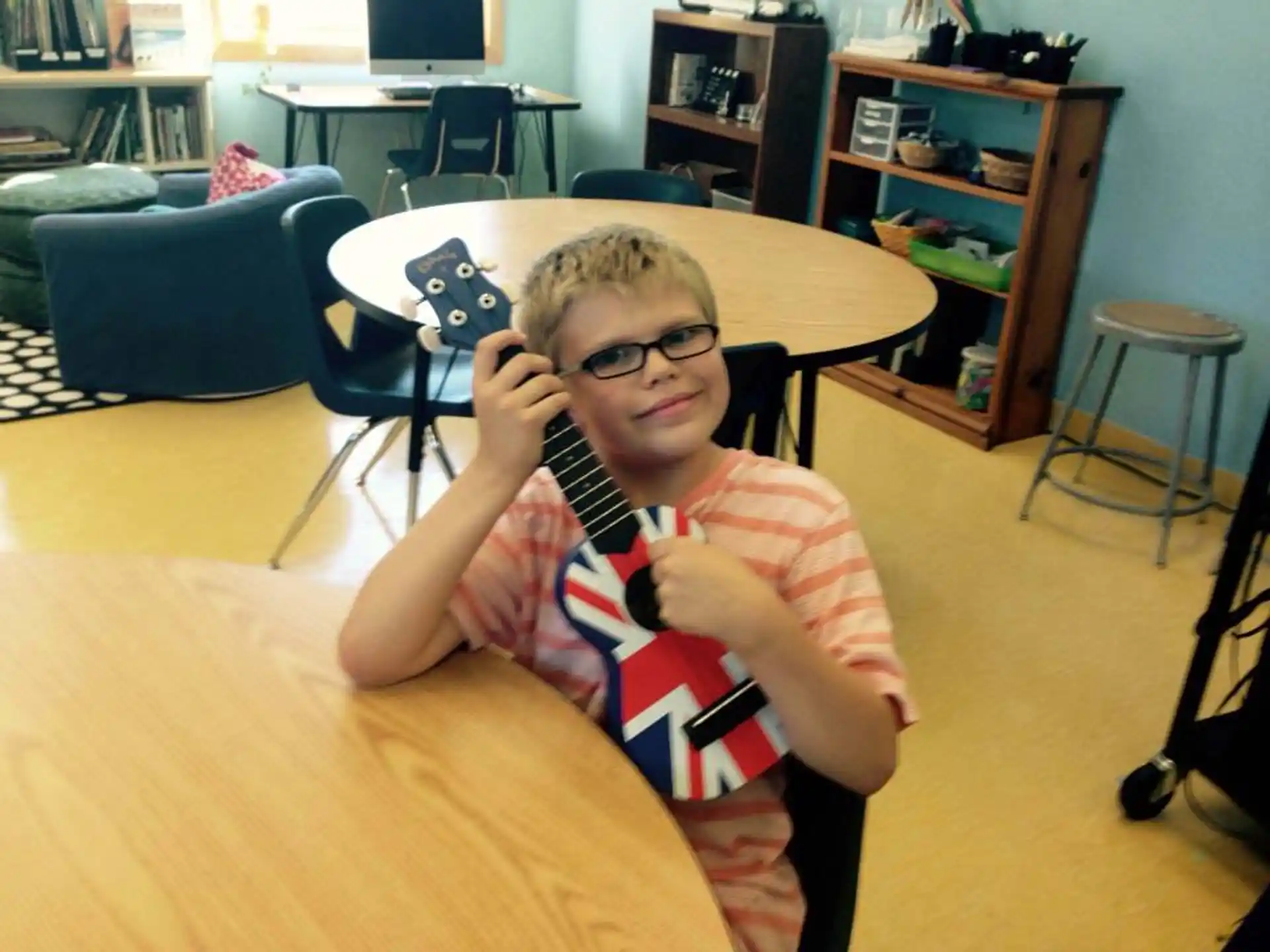 a boy sitting at a table