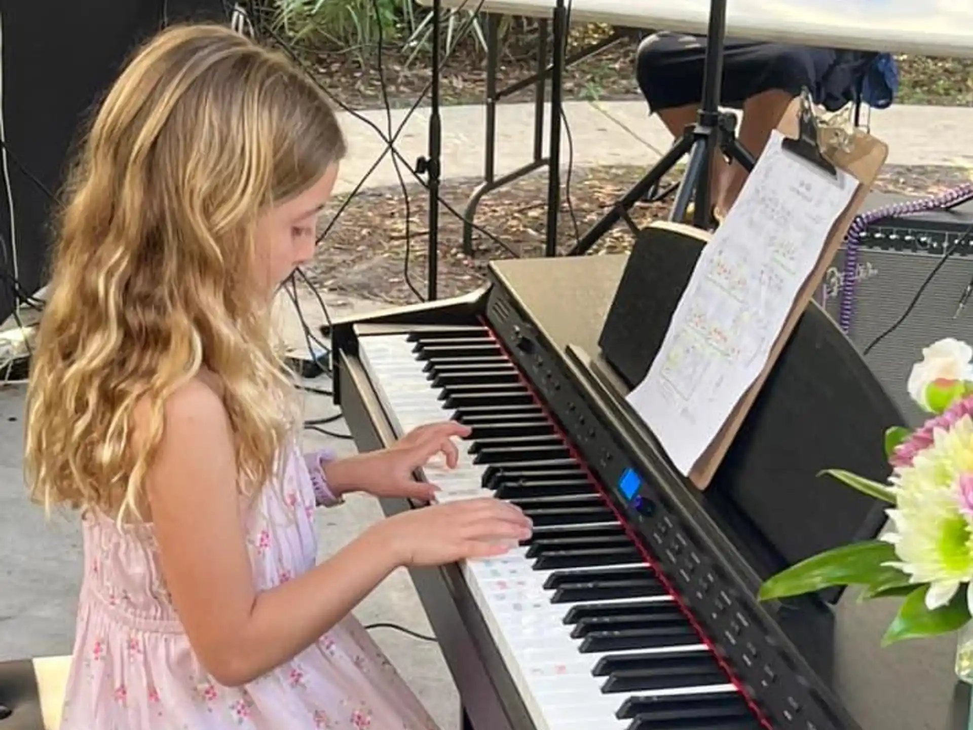 a girl playing a piano