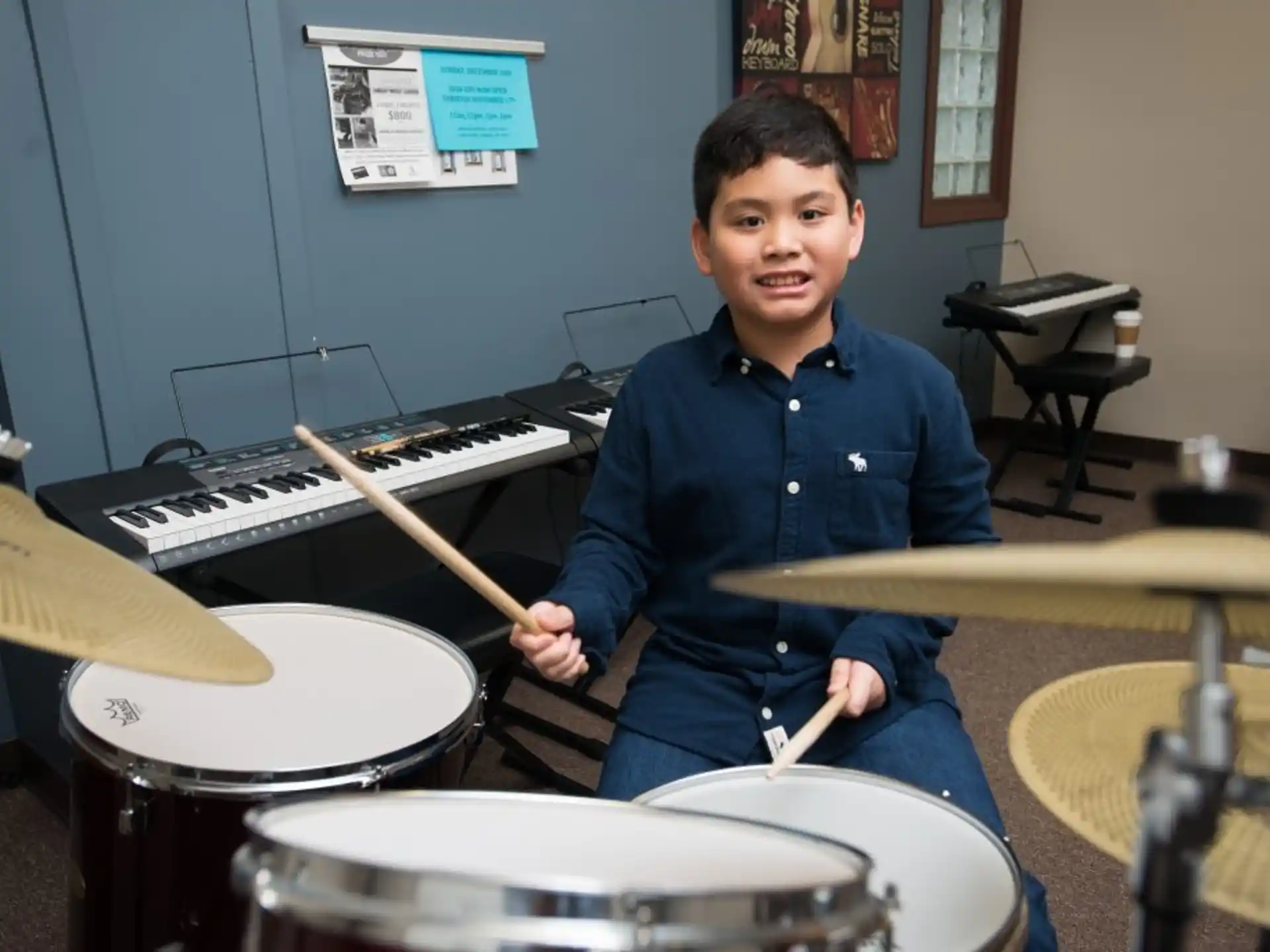 a boy playing drums