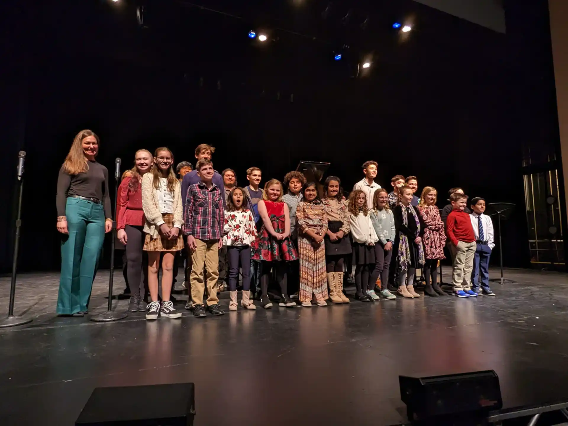 a group of people standing on a stage
