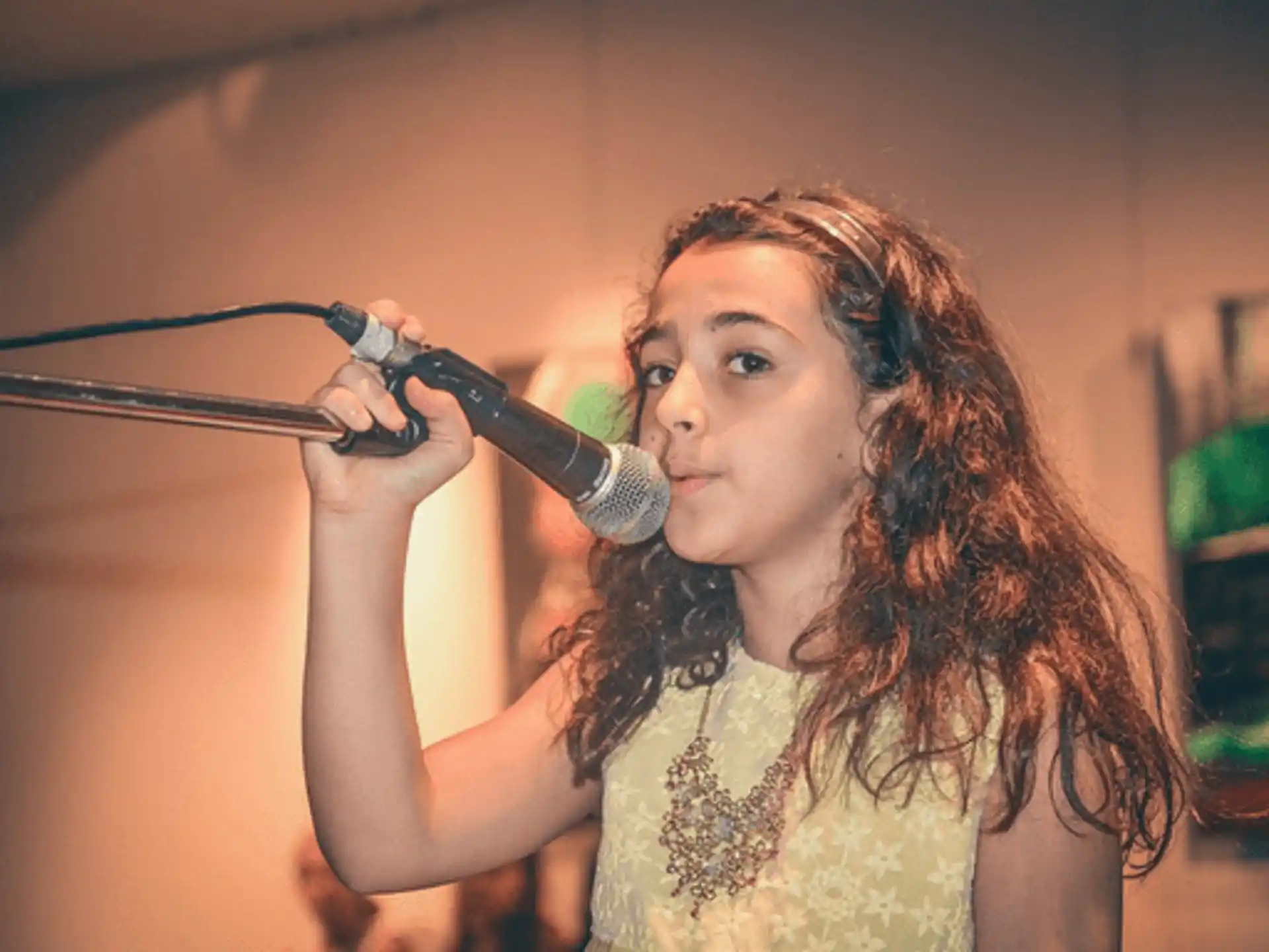 a woman holding a microphone