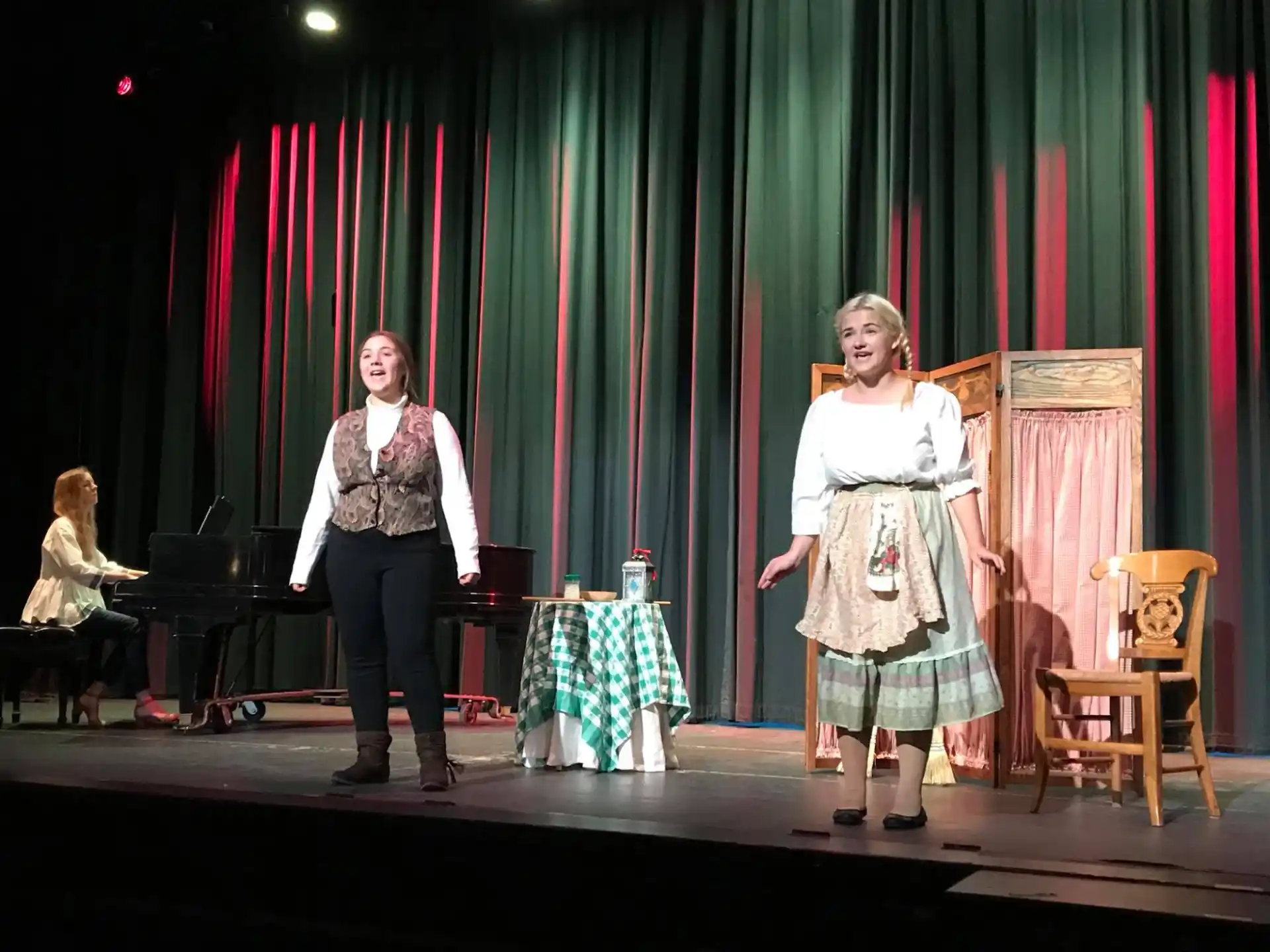 a couple of women on a stage
