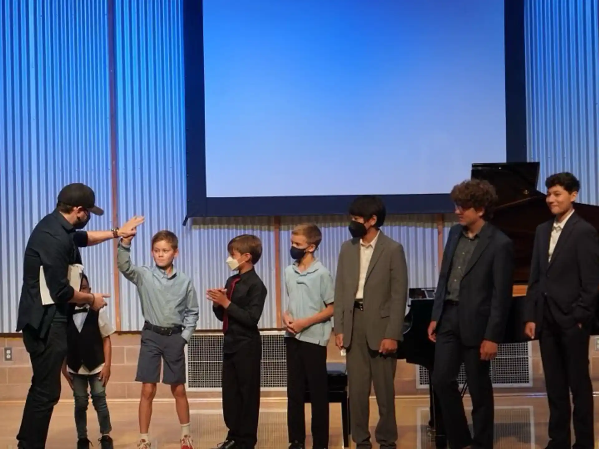 a group of people standing on a stage