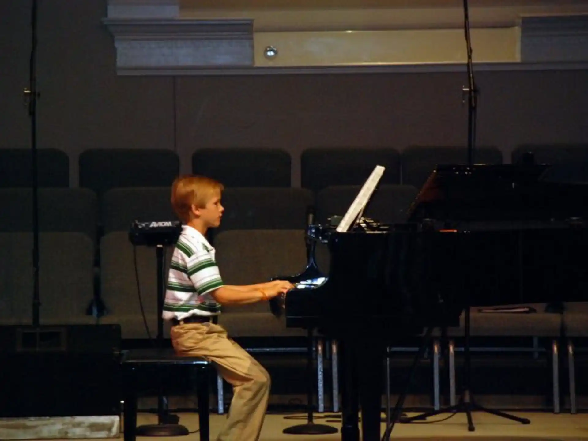 a boy playing the piano