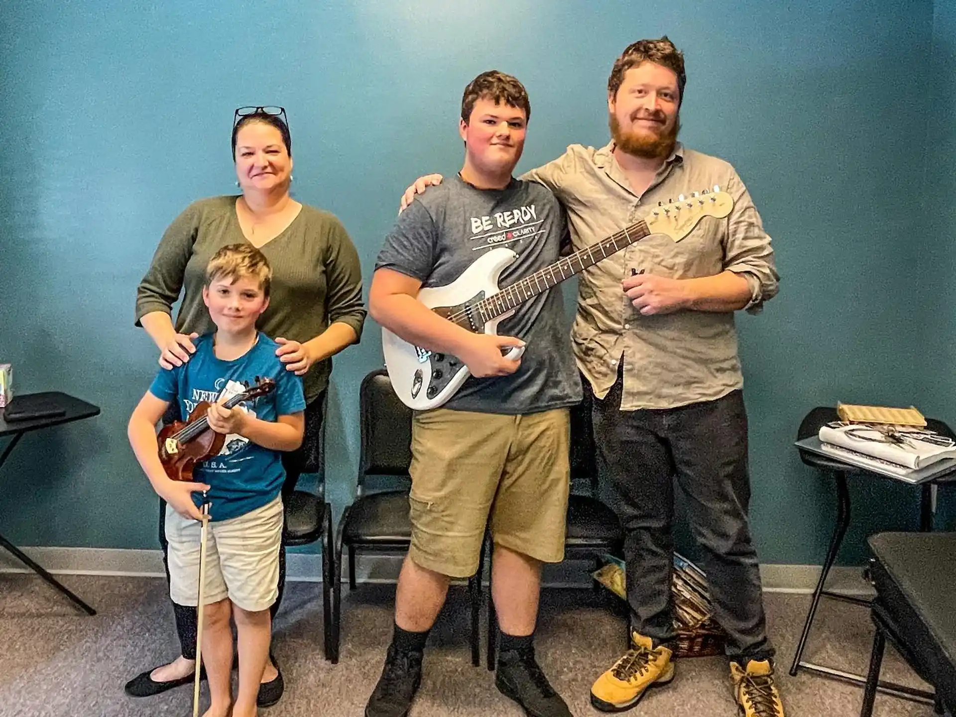 a group of people holding instruments