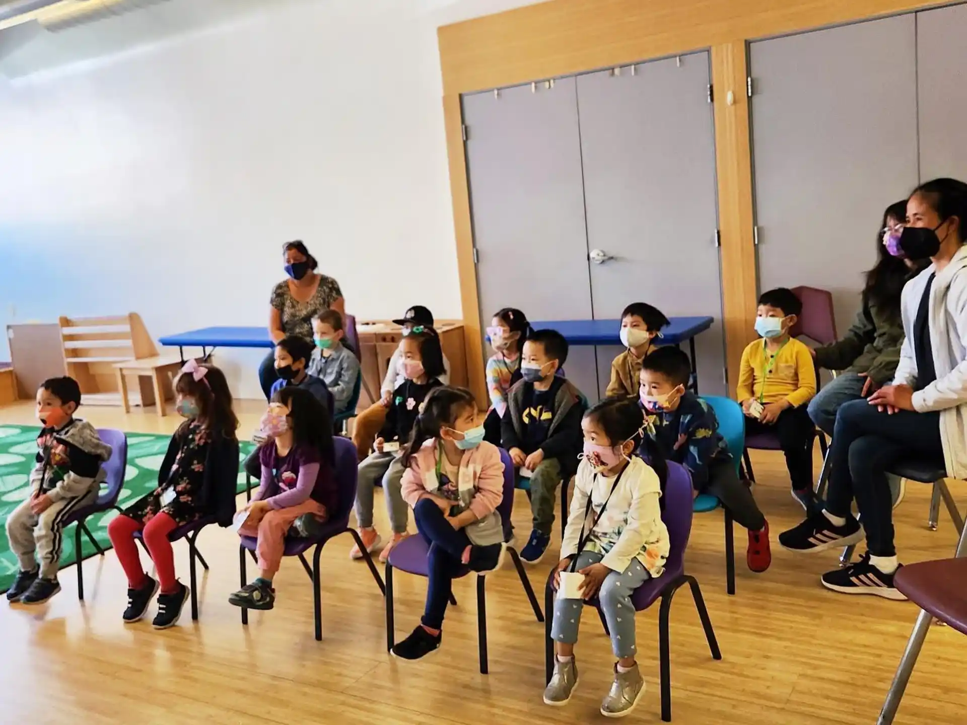 a group of people sitting in chairs