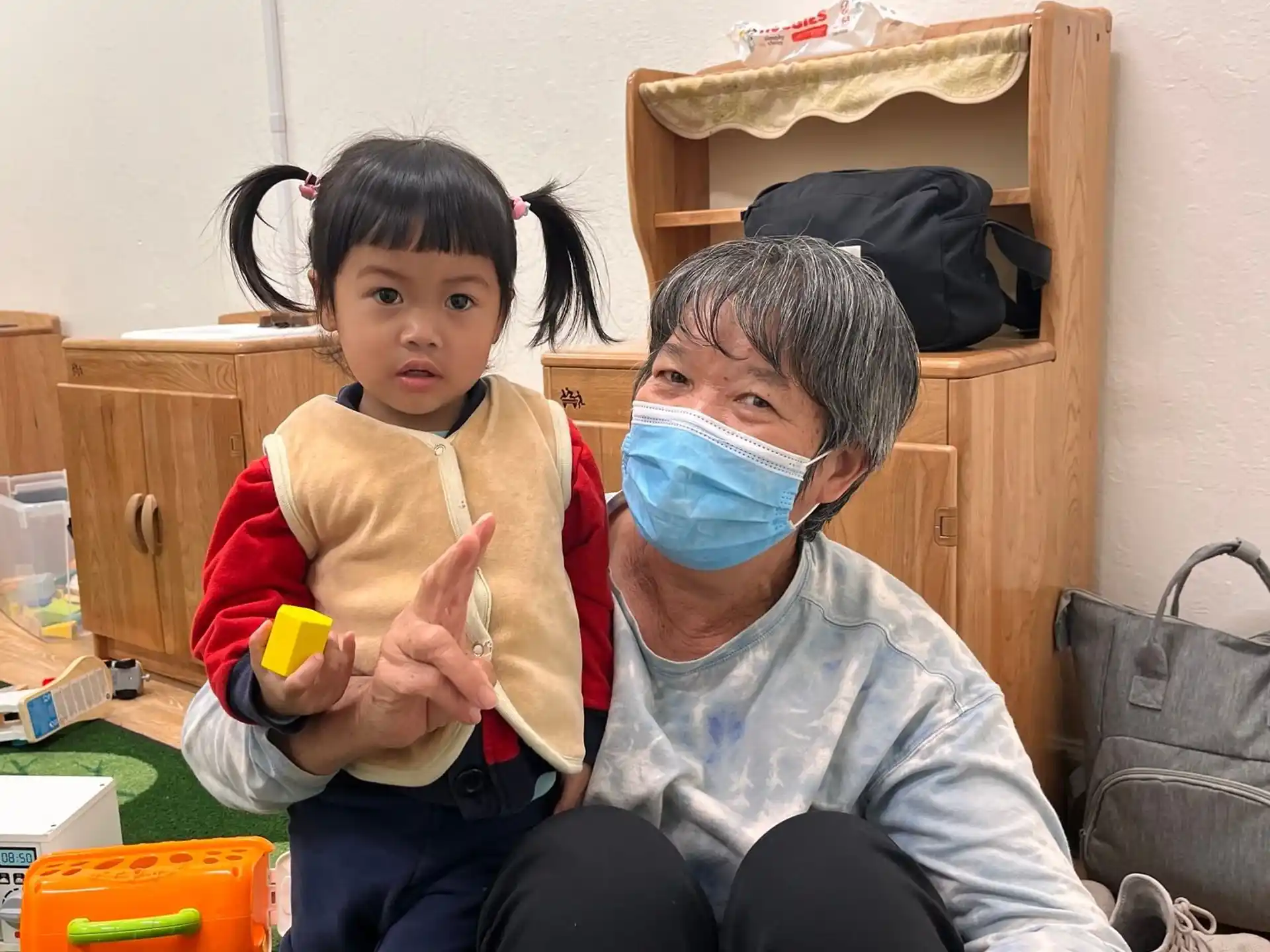 a person holding a child