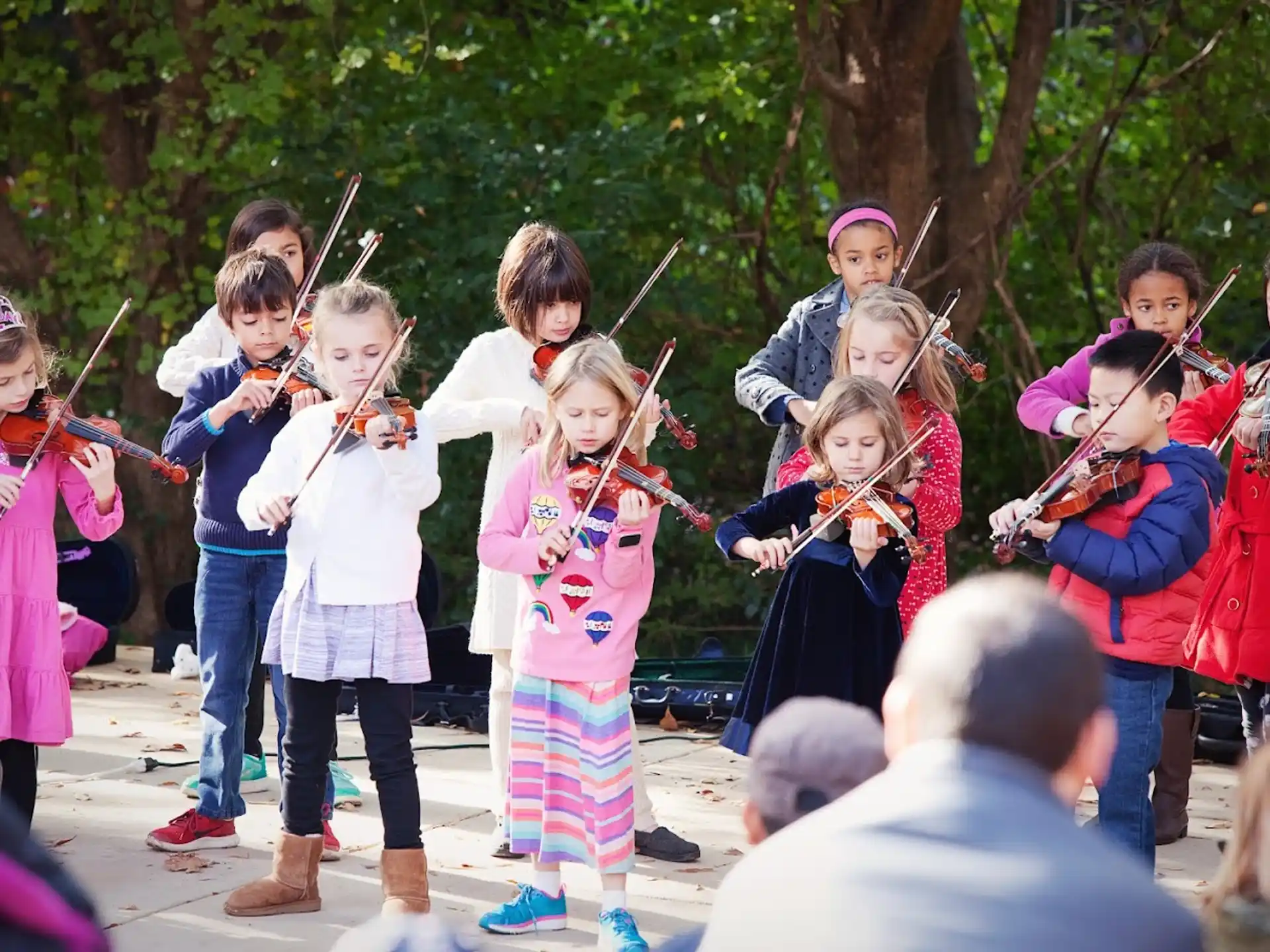 a group of children holding bows and arrows
