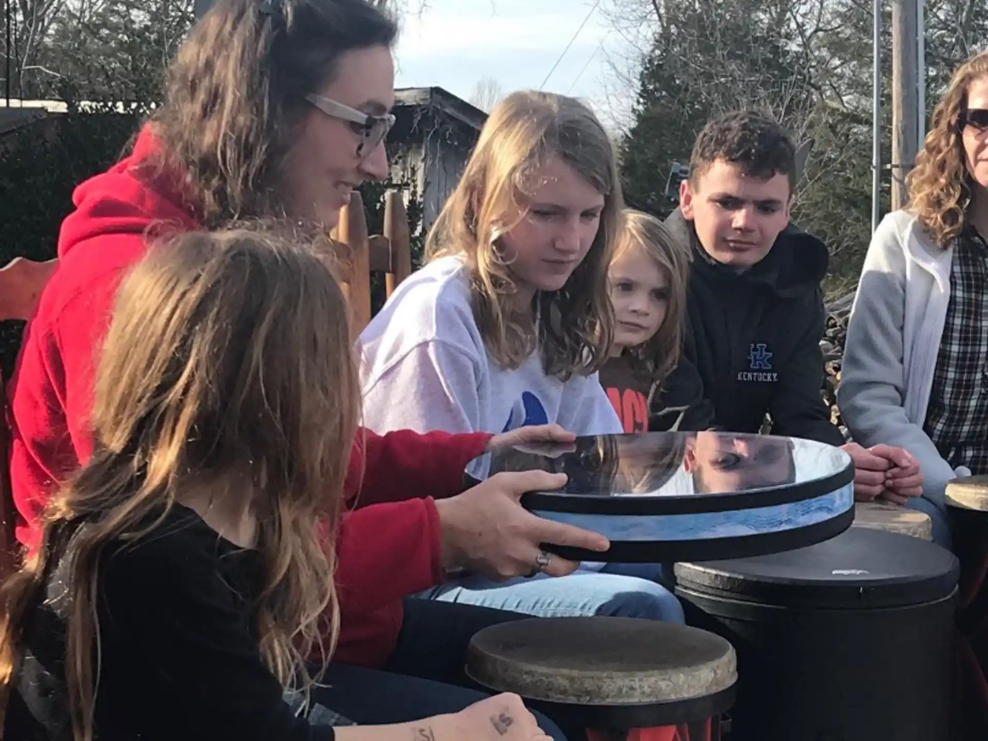 a group of people playing drums