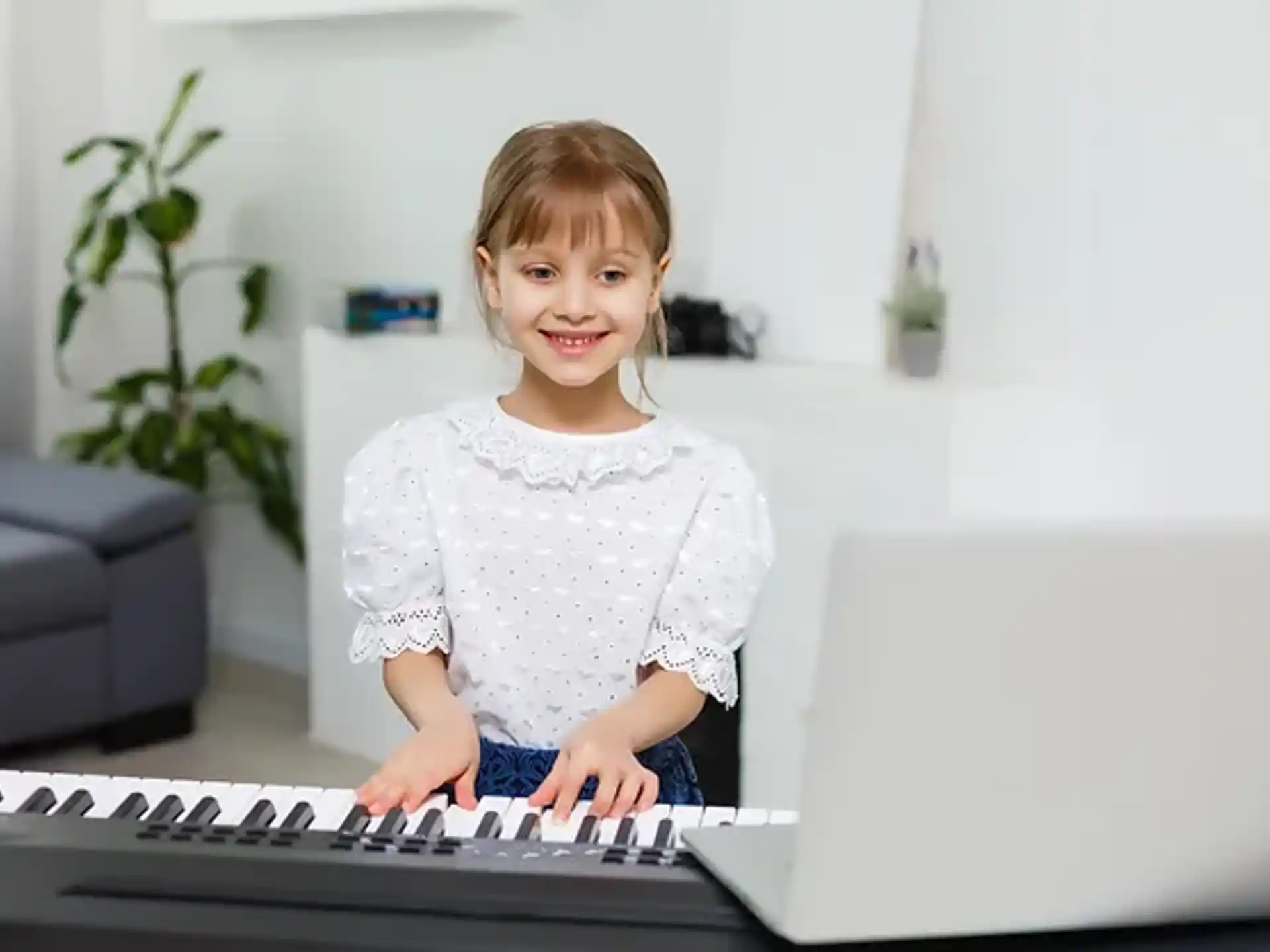 a child sitting at a computer