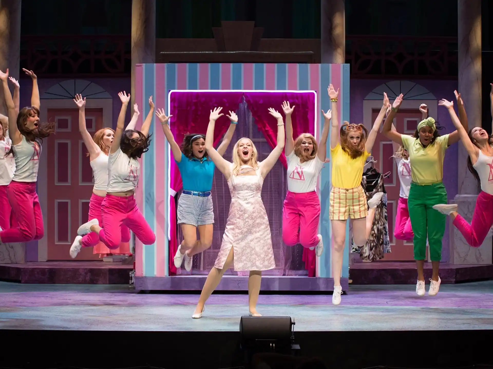 a group of women dancing on a stage