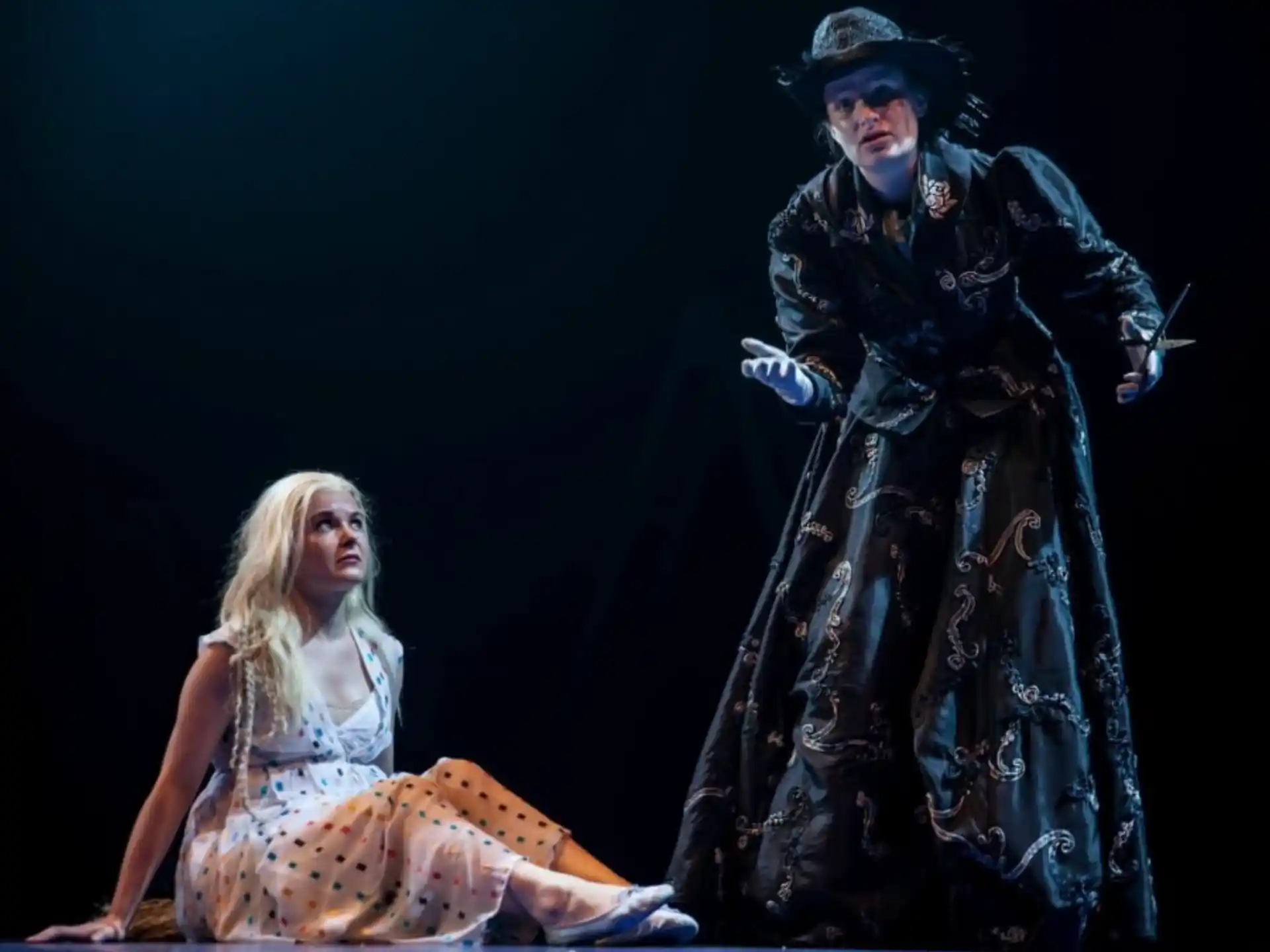 a man and woman on stage