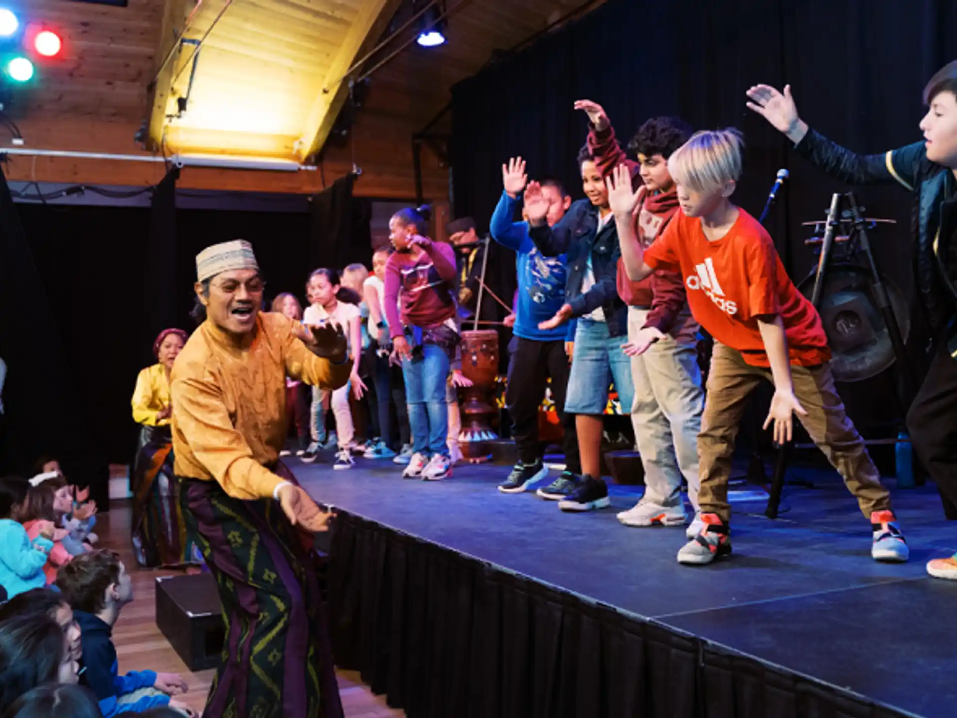 a group of people dancing on a stage