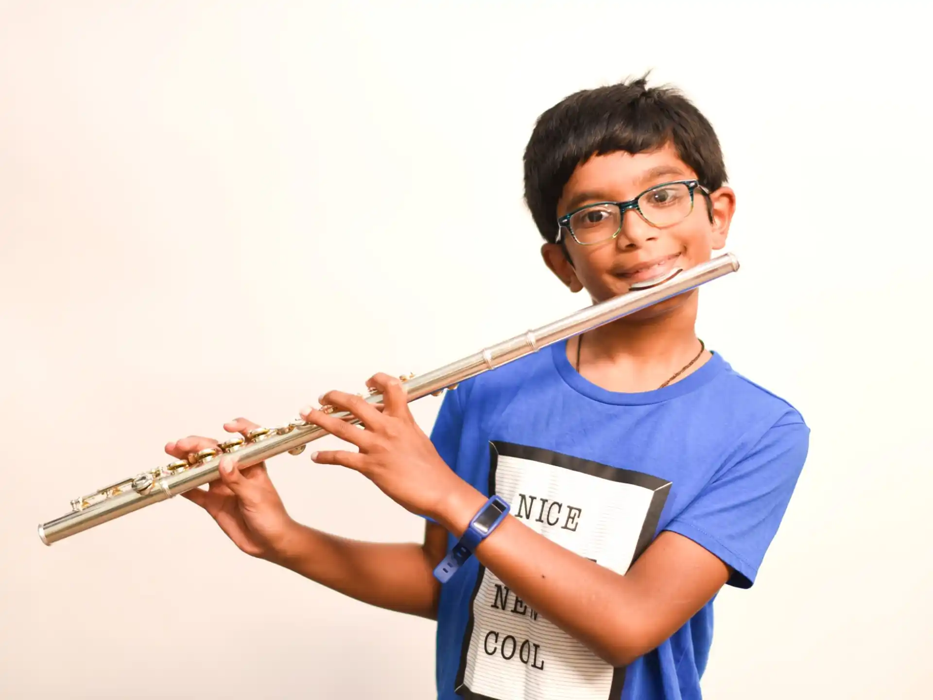 a boy playing a flute