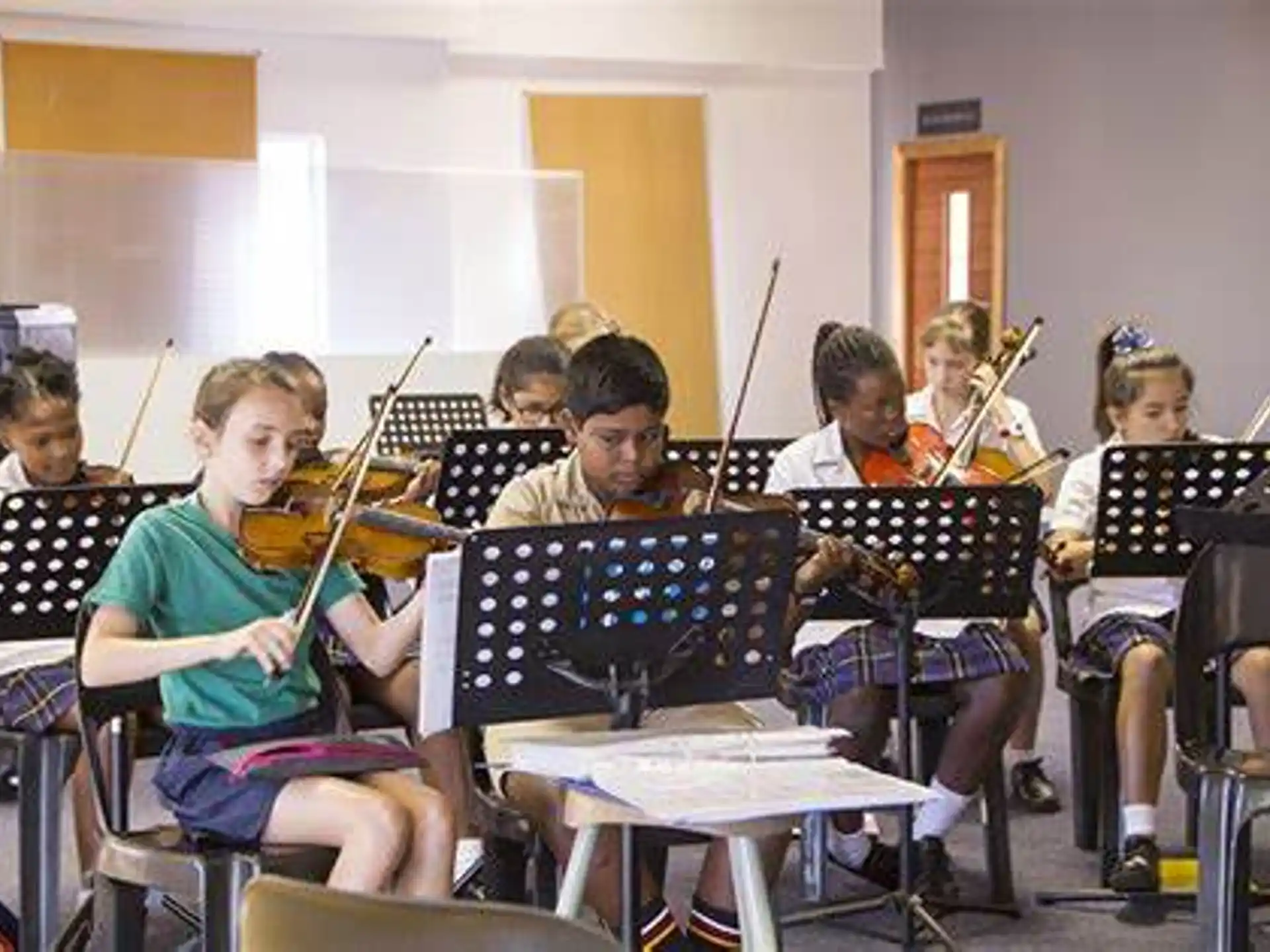 a group of kids playing instruments