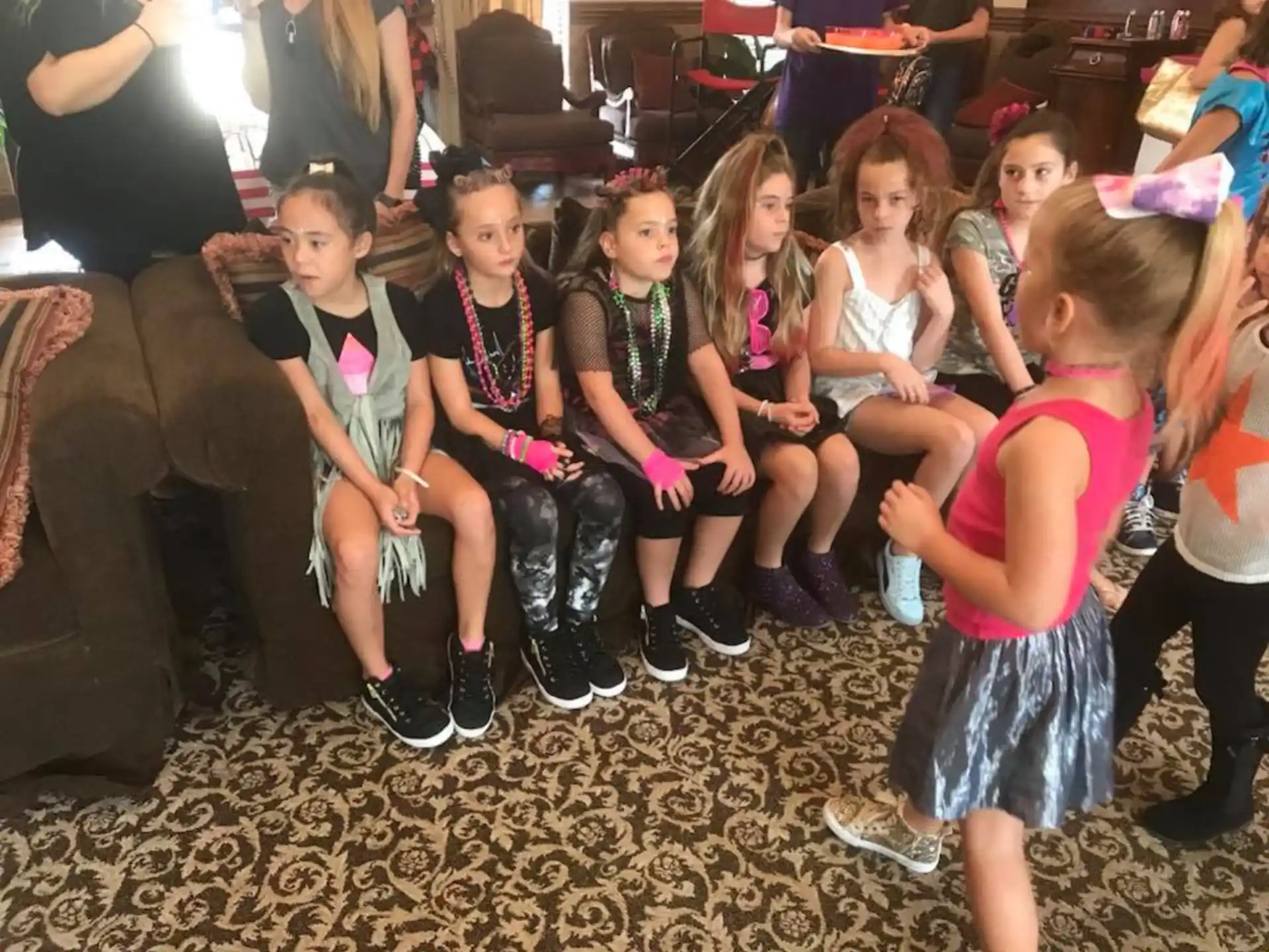 a group of children sitting on the floor